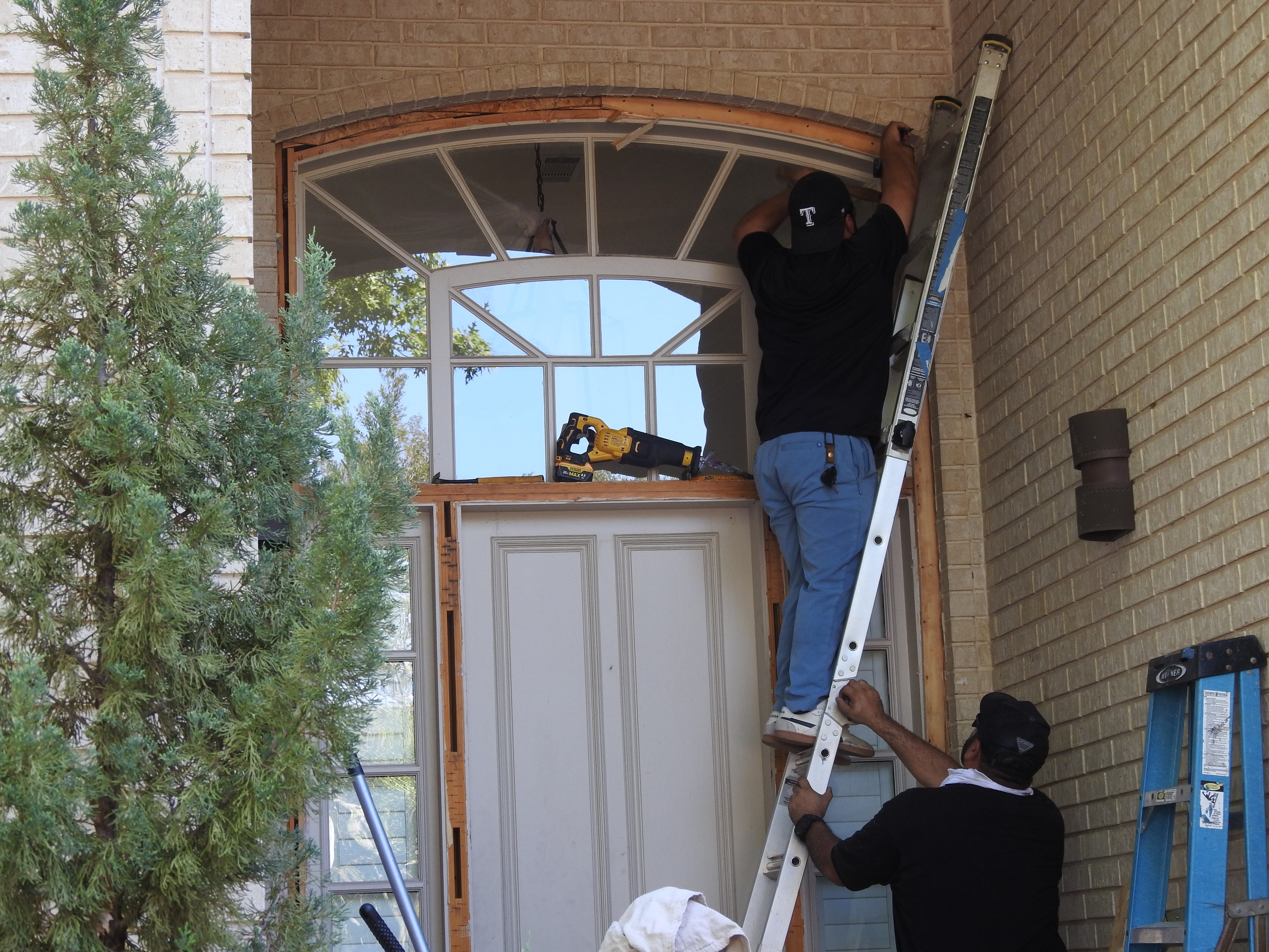 Custom door replacement by two Your New Door door technicians