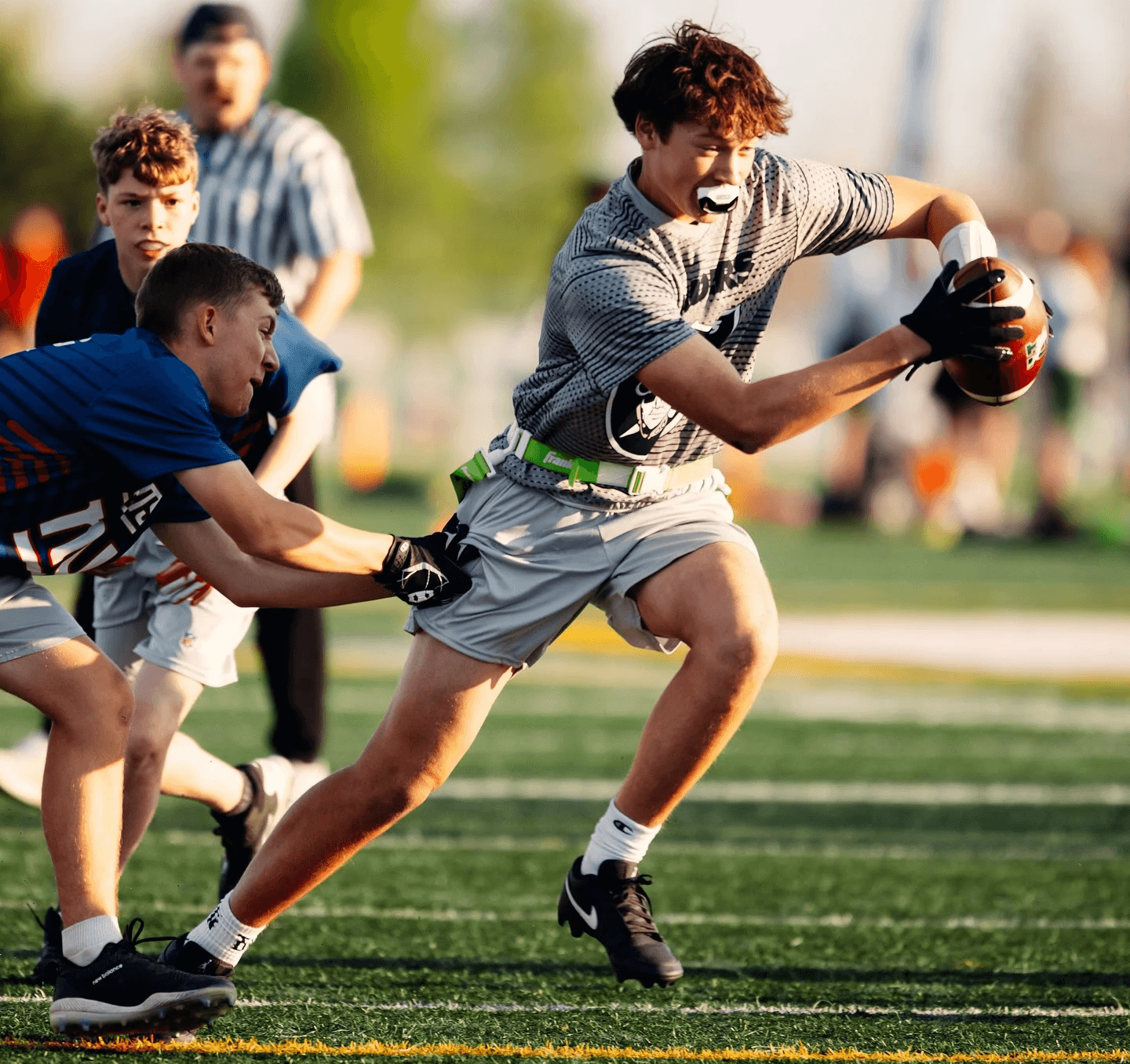Flag football players competing in an NFL Flag program managed with TeamLinkt sports management software