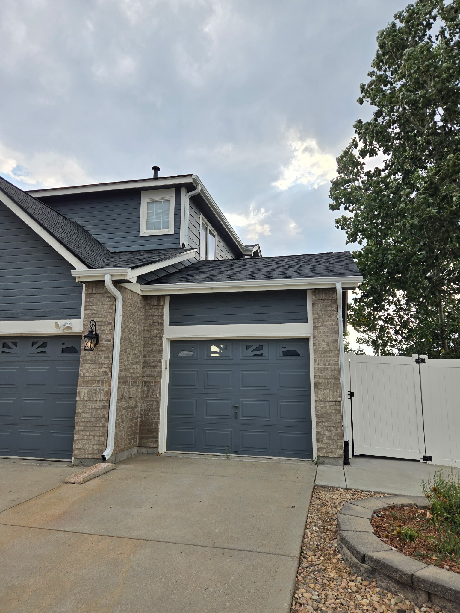 a close up of a roof with a blue sky in the background