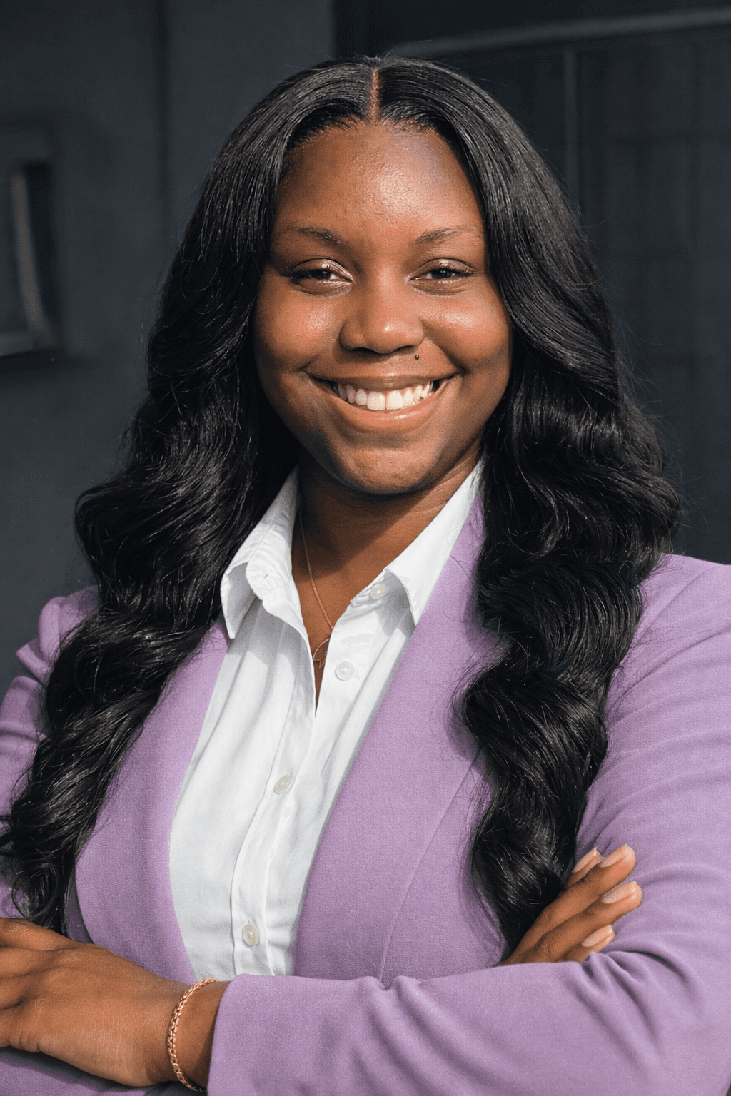 A silhouette of a person standing amidst vibrant swirling colors of teal and orange.