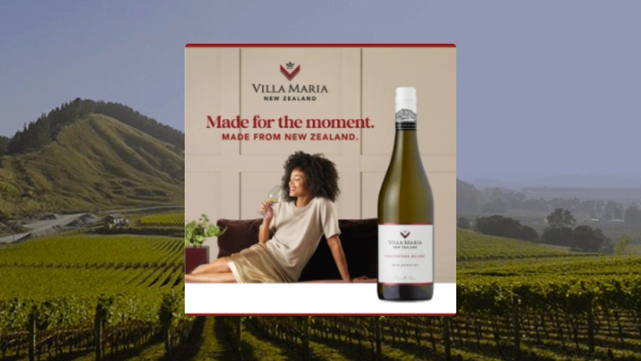 Advertisement for Villa Maria wine featuring a woman relaxing with a glass of wine and a bottle of Villa Maria Sauvignon Blanc, with the tagline 'Made for the moment. Made from New Zealand.'