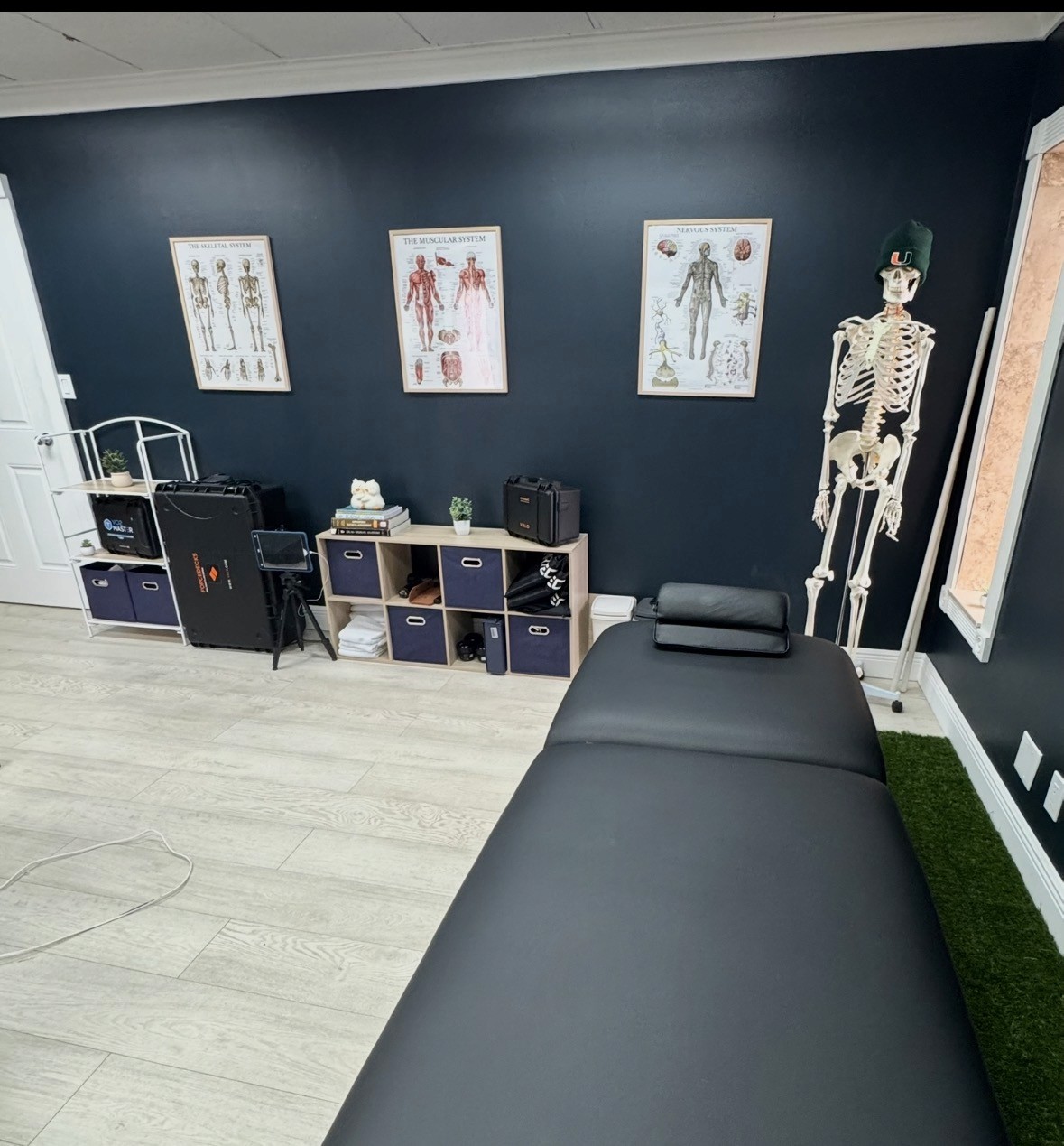 Water bottle resting on a yoga mat in a bright rehab studio—symbolizing hydration, recovery, and wellness during mobility, stretching, or physical therapy sessions.