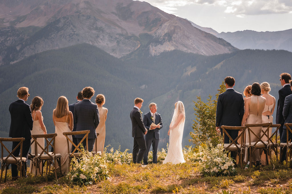 Mountain ceremony at Smith Cabin Aspen wedding with couple exchanging vows overlooking Aspen peaks