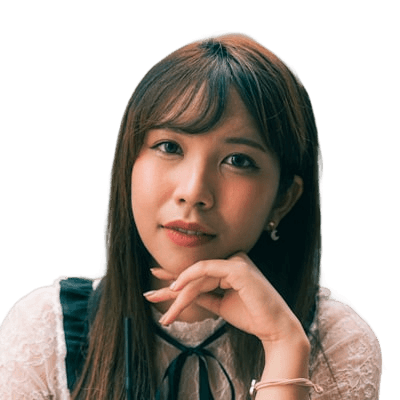 Close-up of a smiling Asian woman with long brown hair, resting her chin on her hand, wearing a dress.