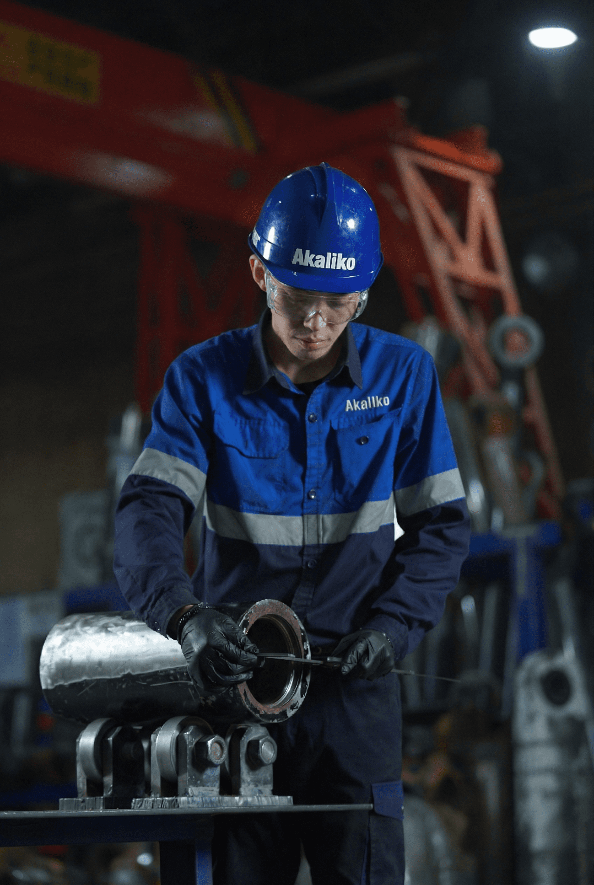 Male engineer in orange uniform and helmet standing with arms crossed          Ask ChatGPT