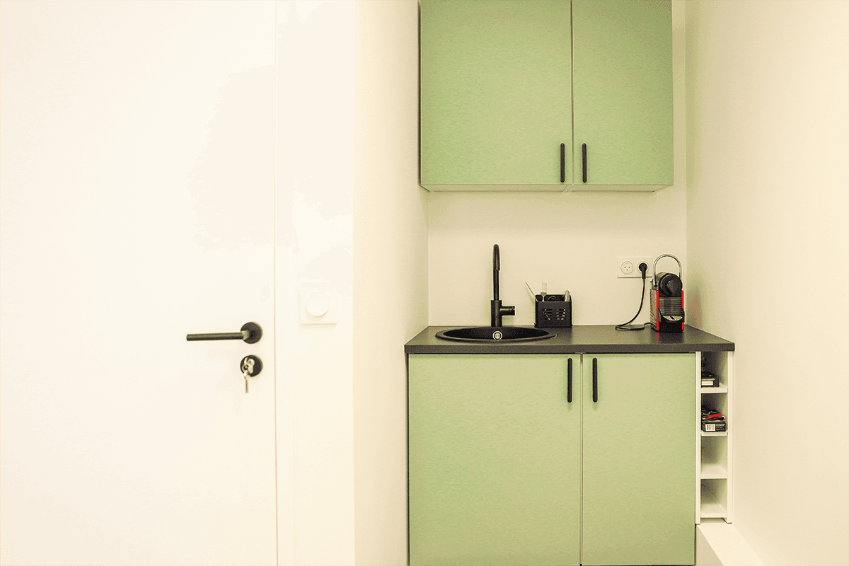 Streetside billboard with flyposters of the Batch.Works brand and illustrations