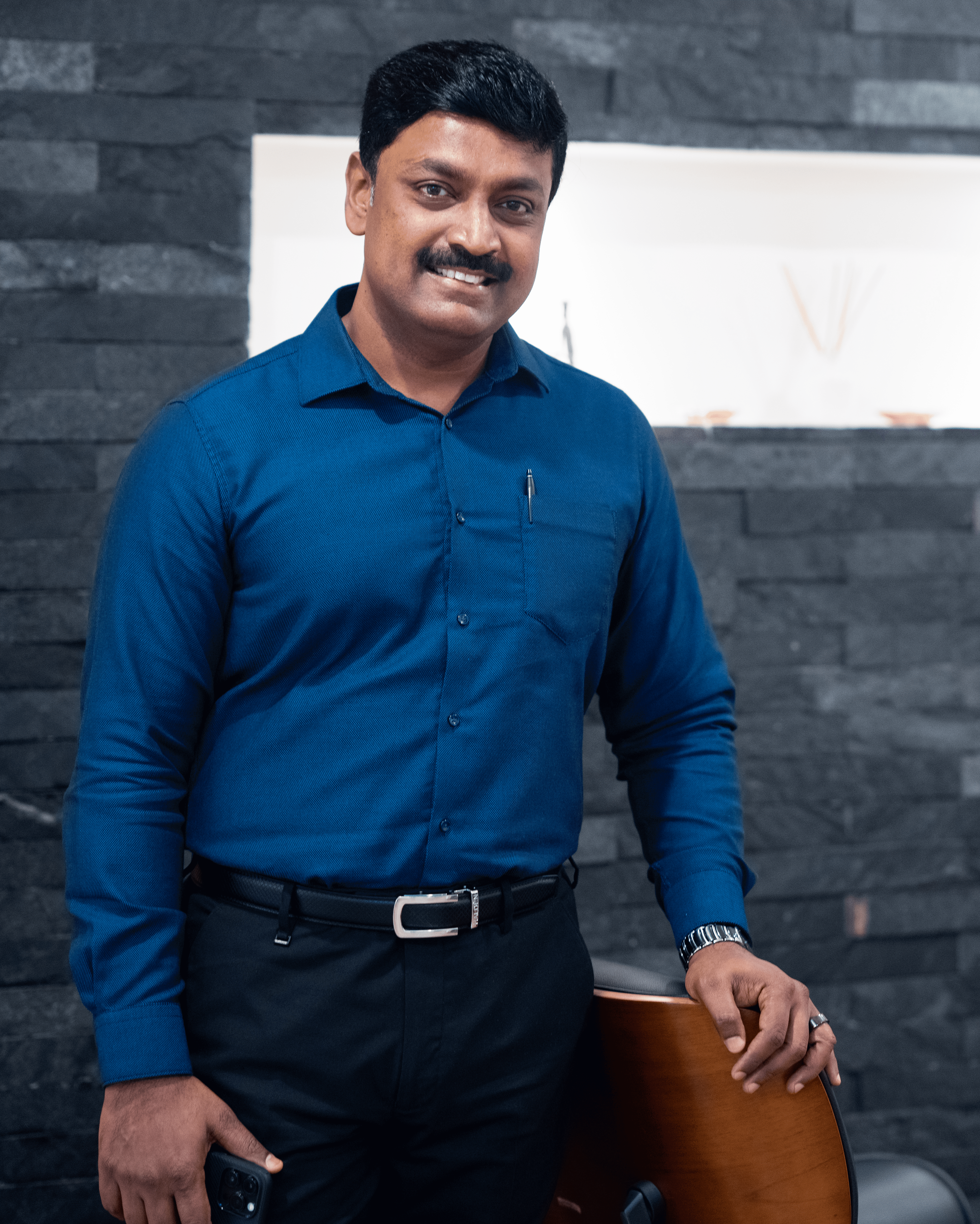 a group of people sitting at a table with computers