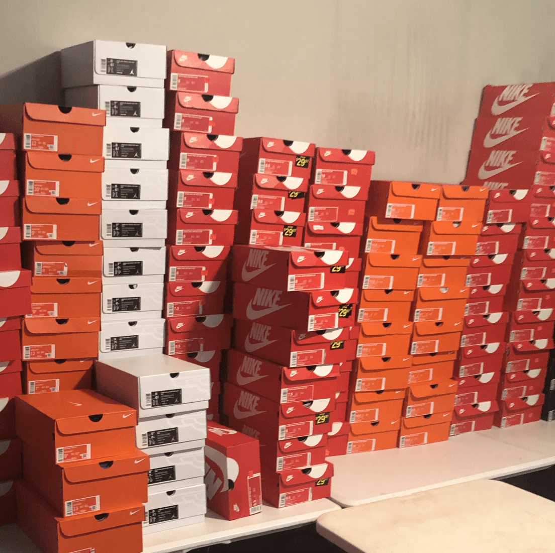 Shoe boxes piled up in a seller's home