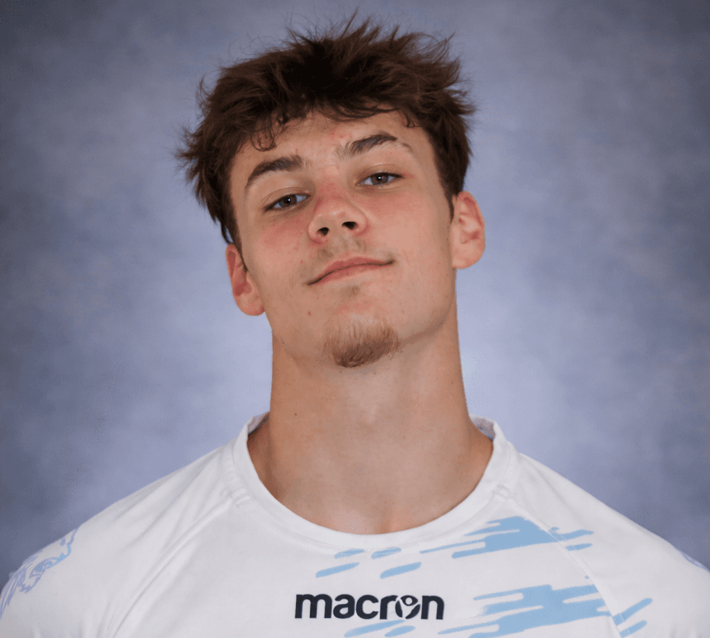 smiling woman wearing white and black pinstriped collared top