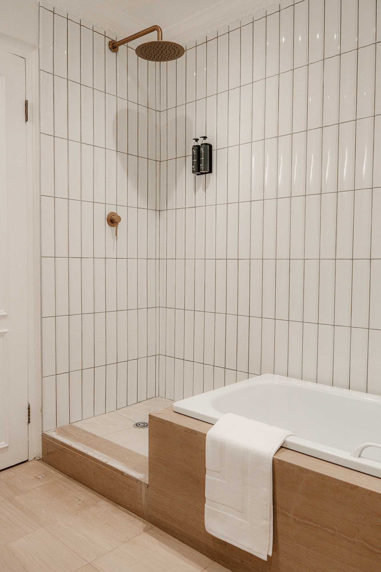 Redlands Hotel Executive Suite bathroom featuring modern bath and shower