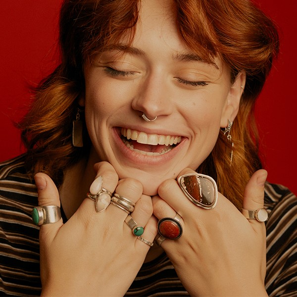 girl smiling over her rings
