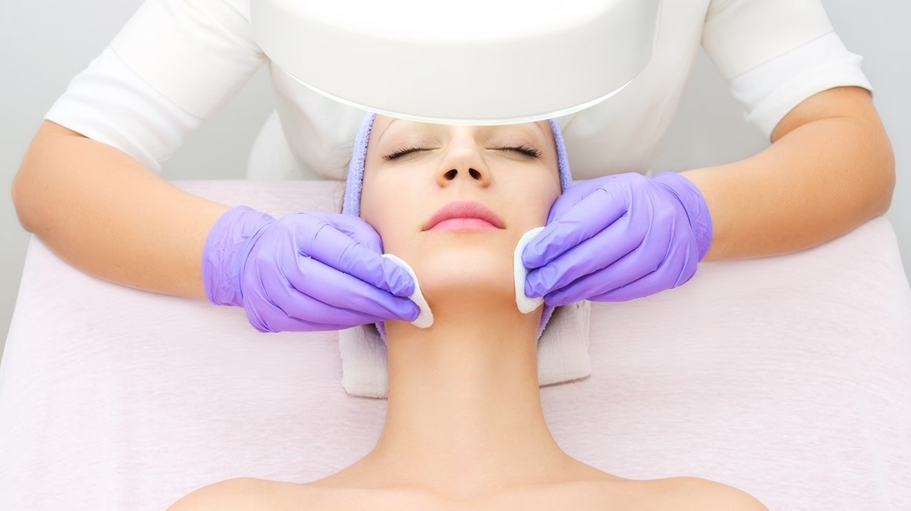 Acne treatment procedure with a professional skincare therapist.