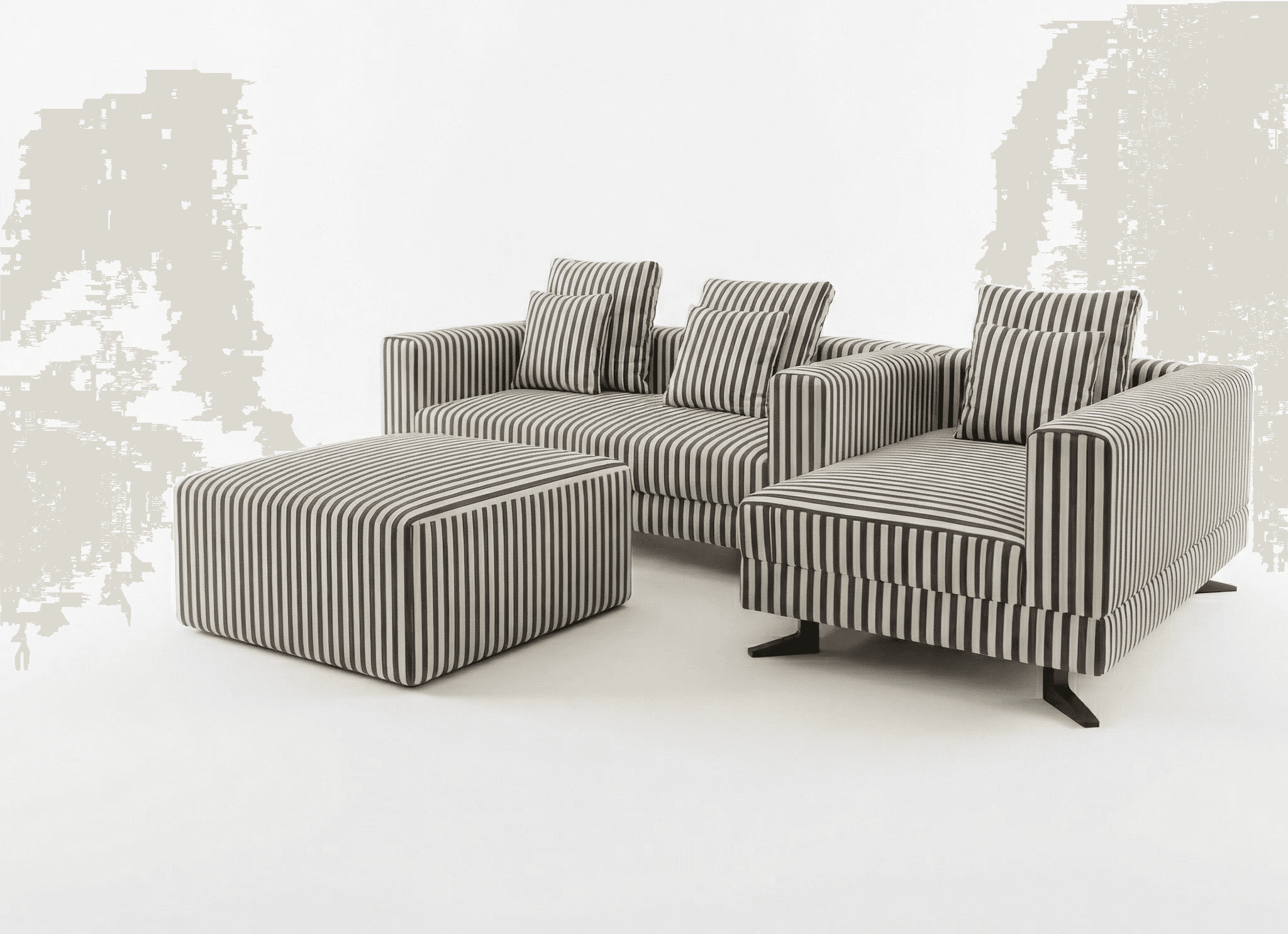 Luxury lounge seating with striped armchairs styled in a minimalist neutral interior