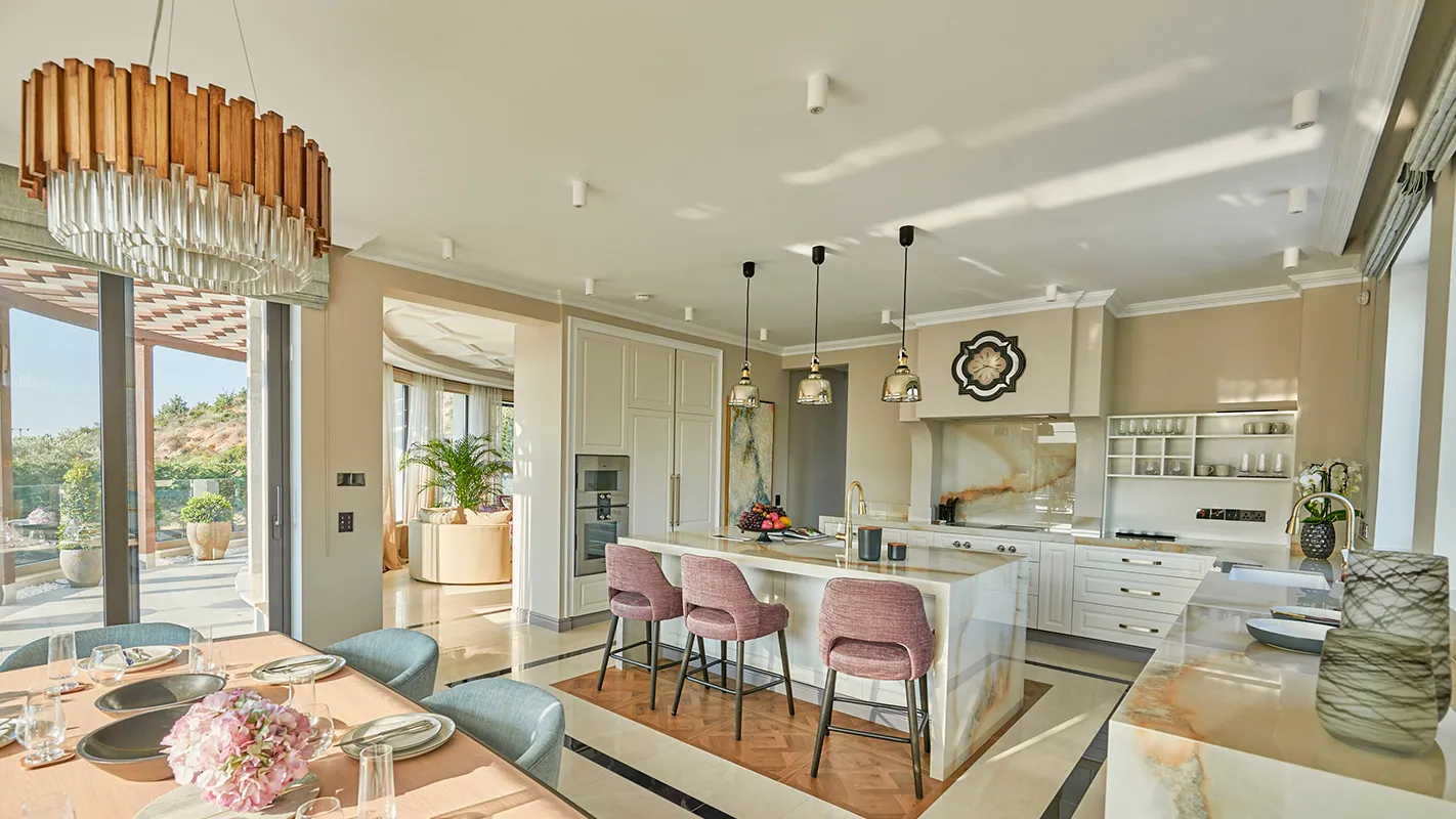 Villa Belmare open-plan kitchen with marble island, pendant lighting, and bar seating