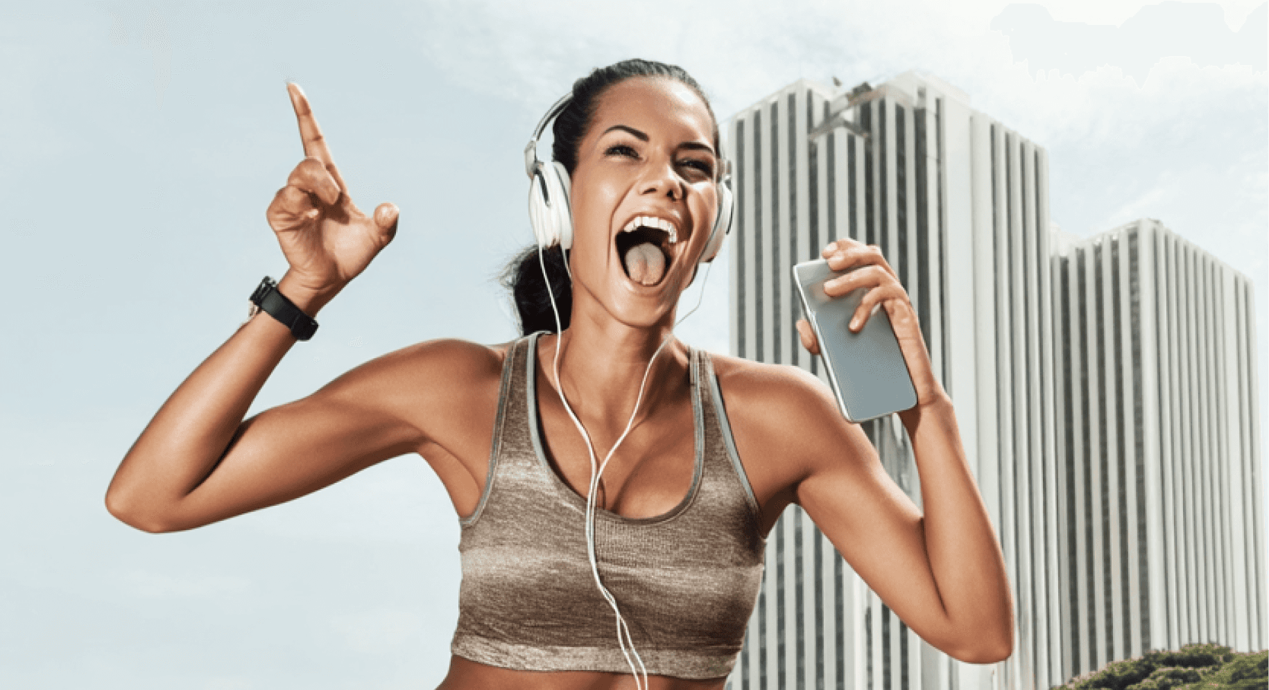 Energetic woman in workout clothes smiling with headphones and smartphone, next to the text 'Want to lose fat in a sustainable way.