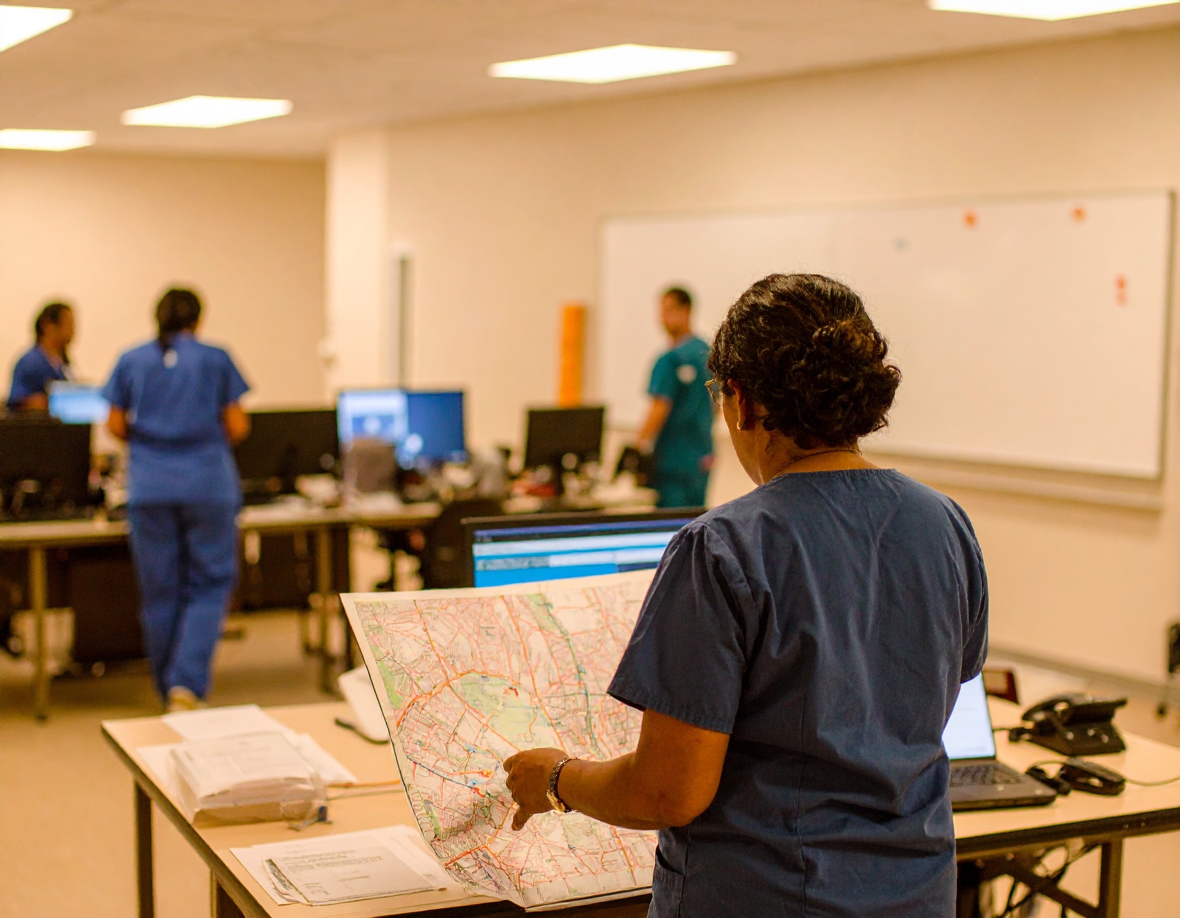 command room with healthcare professionals