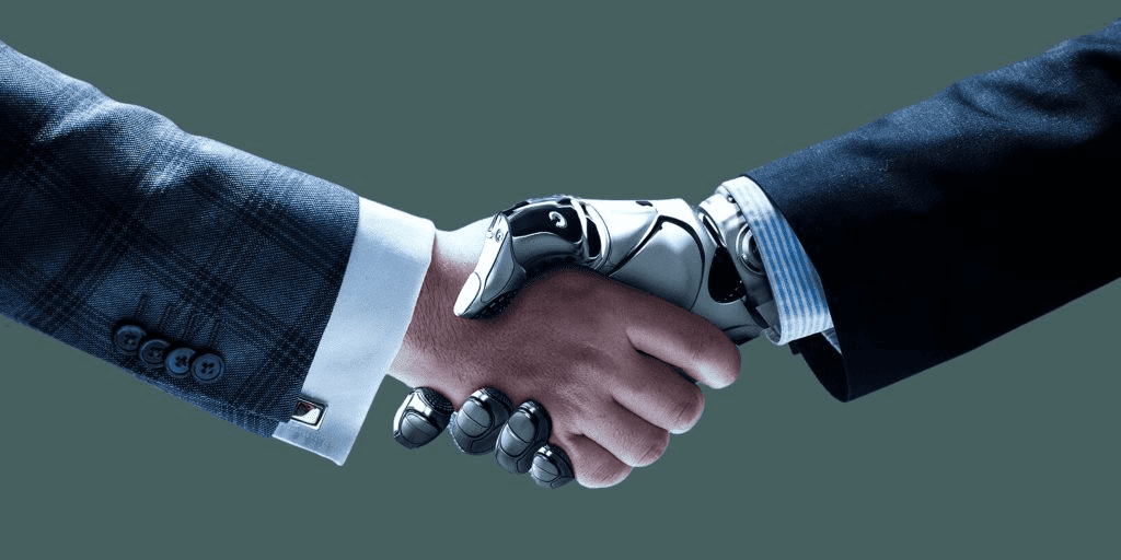 Man shaking hands with a robot.