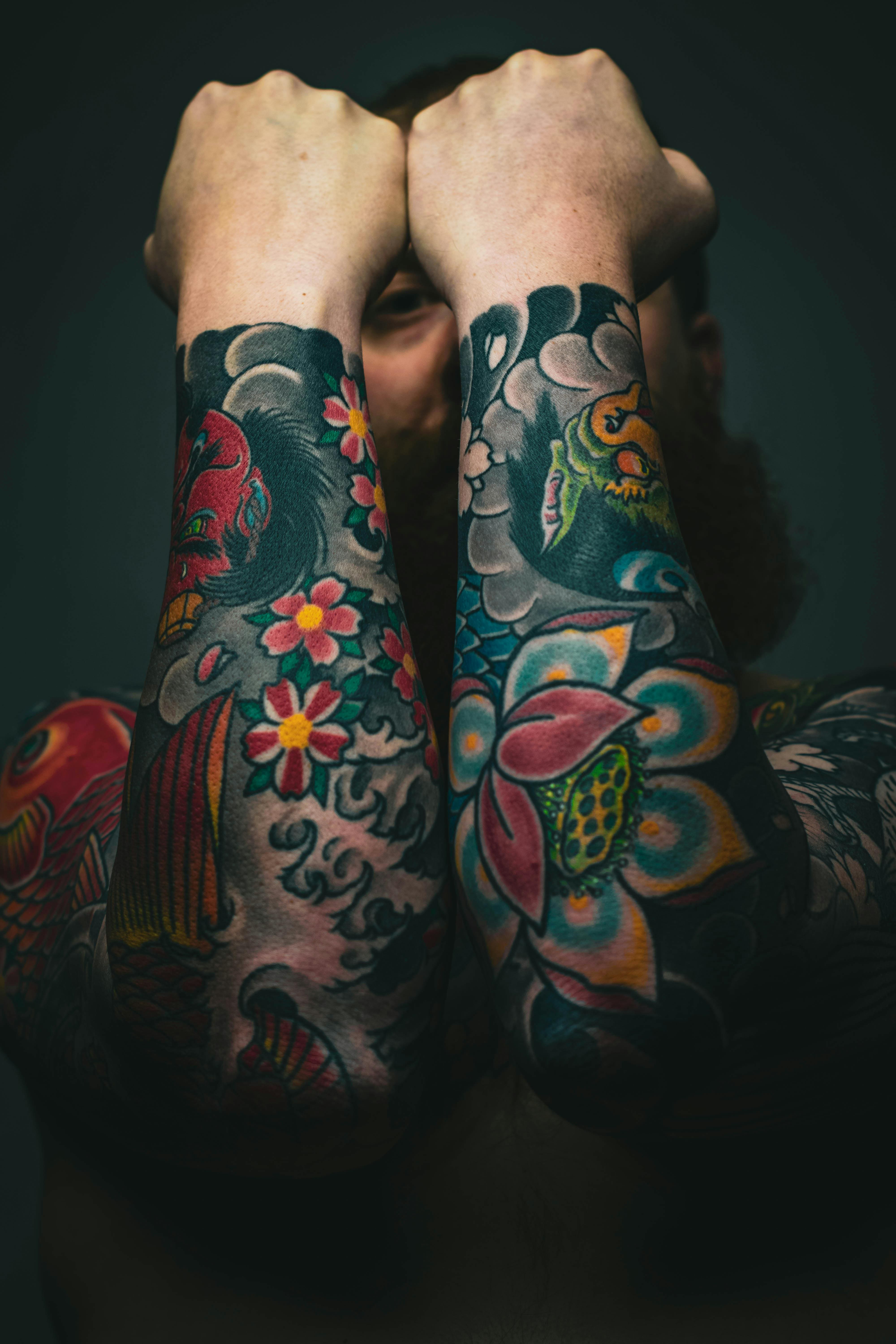 Double sleeves tattooed on a man in Japanse style