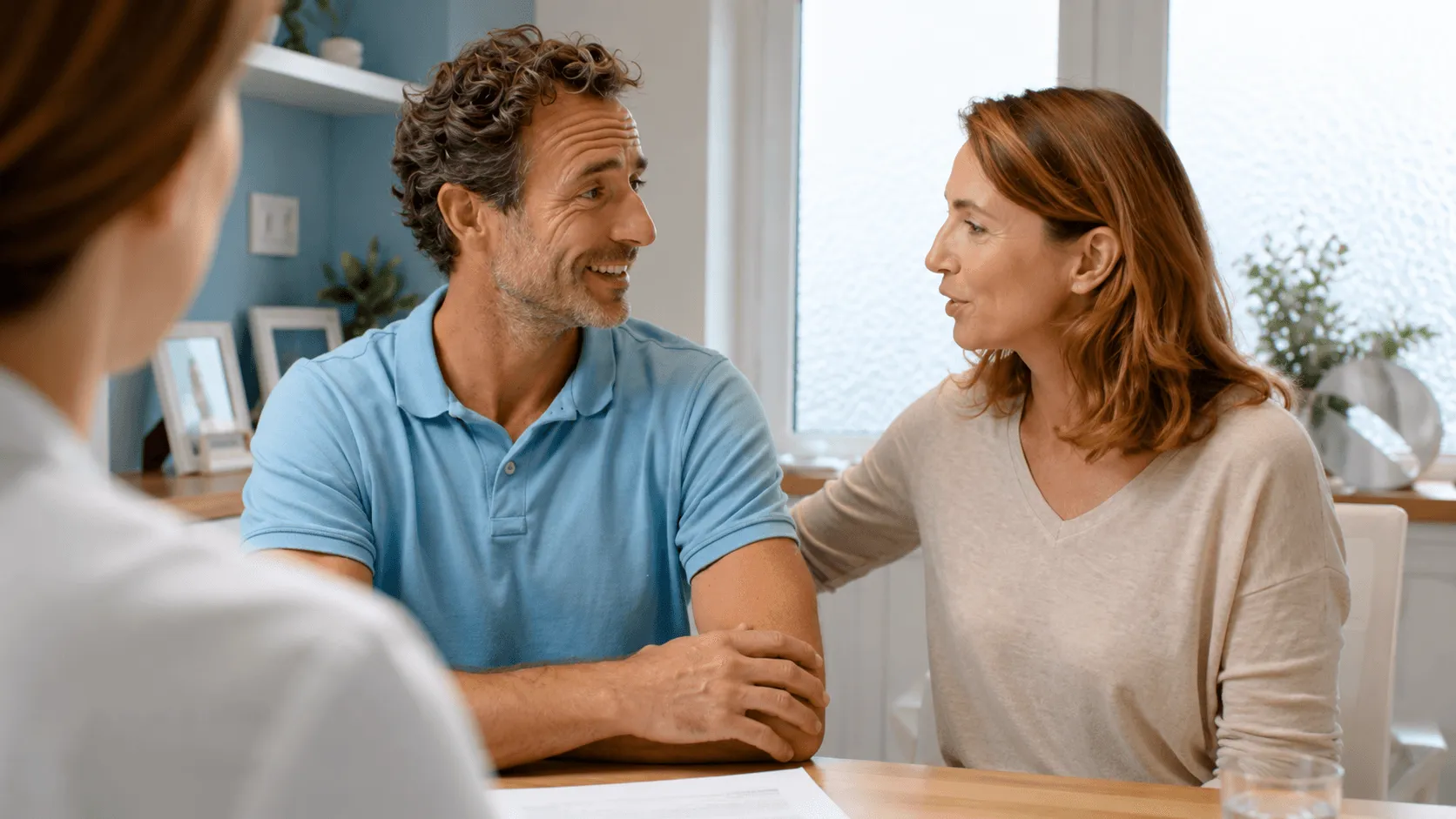 Couple and advisor talking at table
