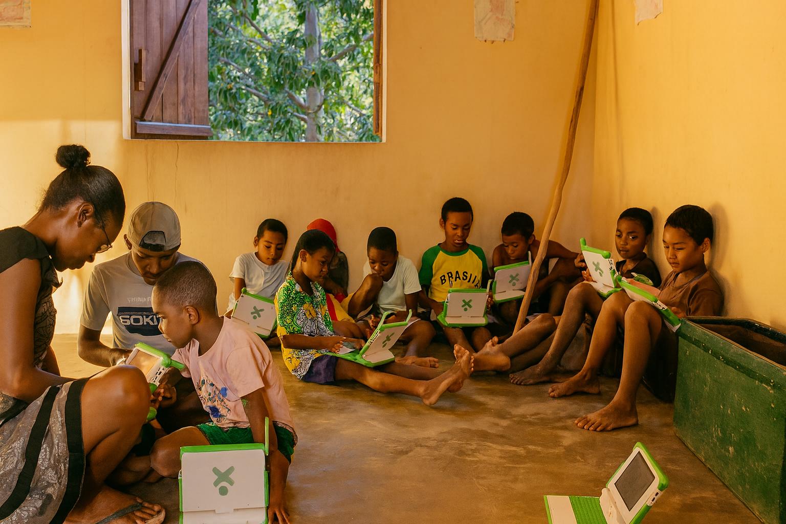 people sitting on chair in front of laptop computers