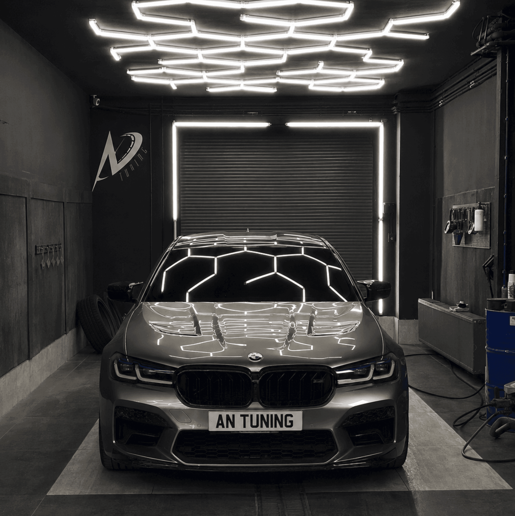running black Porsche sedan