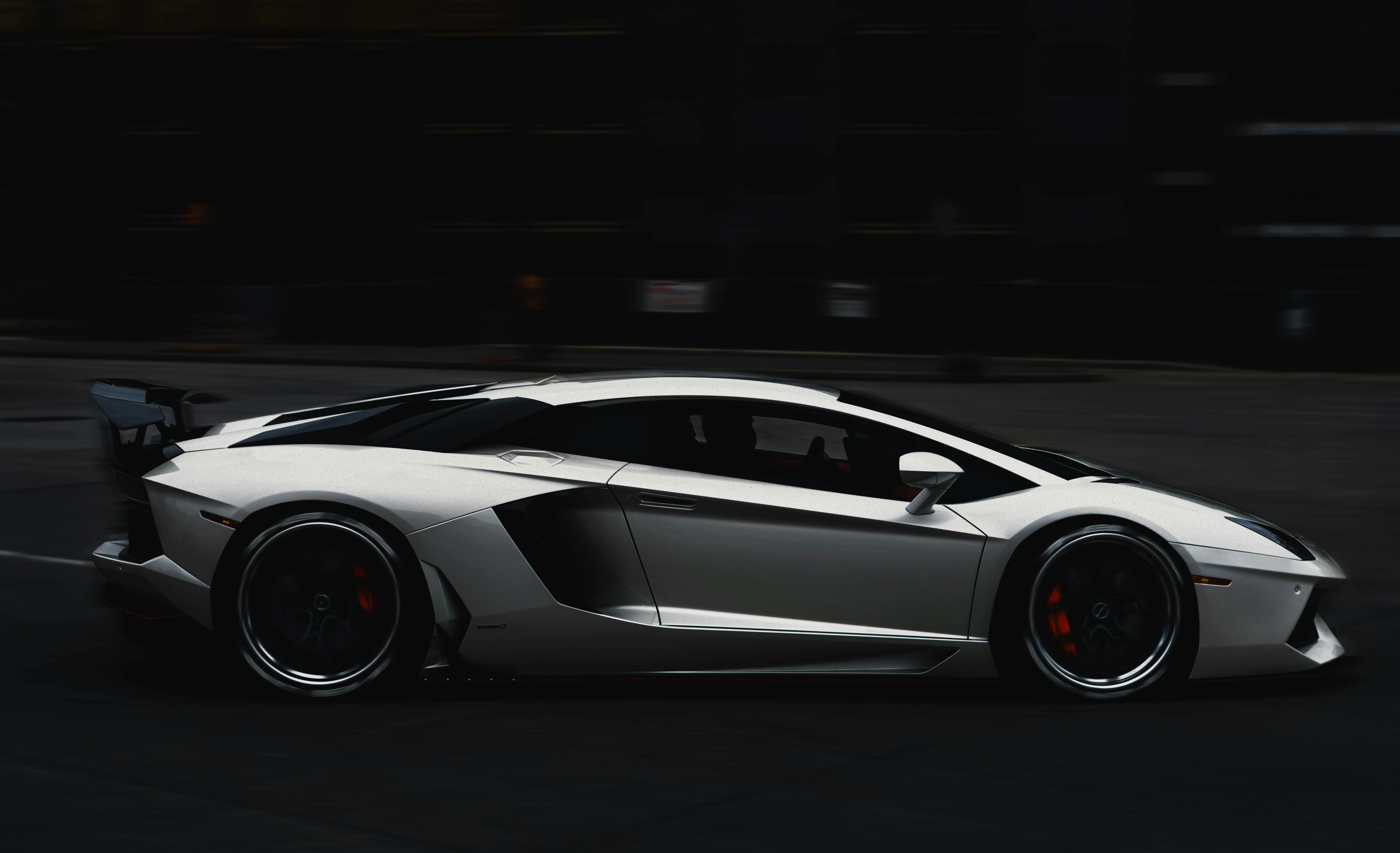 Silver supercar profile view