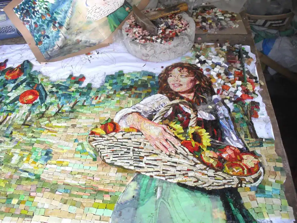 Vibrant mosaic backsplash mural of a woman with a basket, inspired by orchard scenes. Perfect for ki.