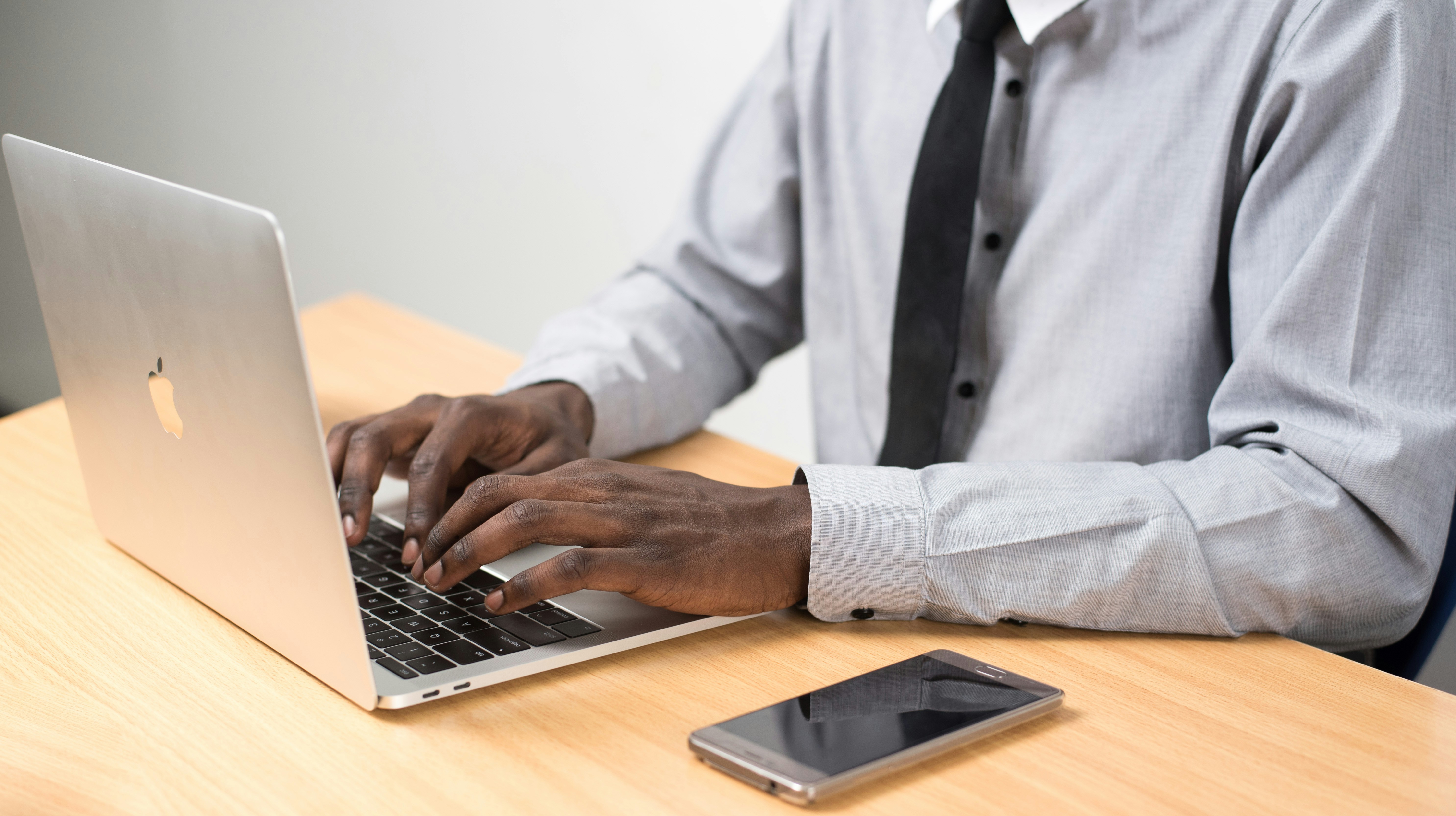 person typing on laptop - Graduate School Reading