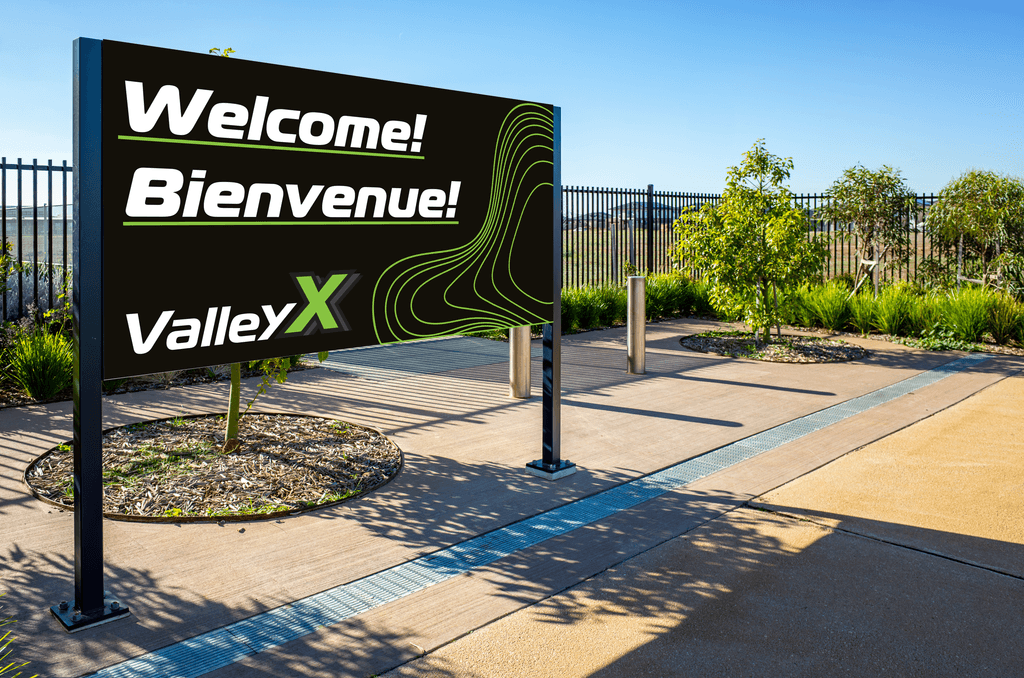 still image of the guitar and amplifier infront of a soundwave over a green gradient background