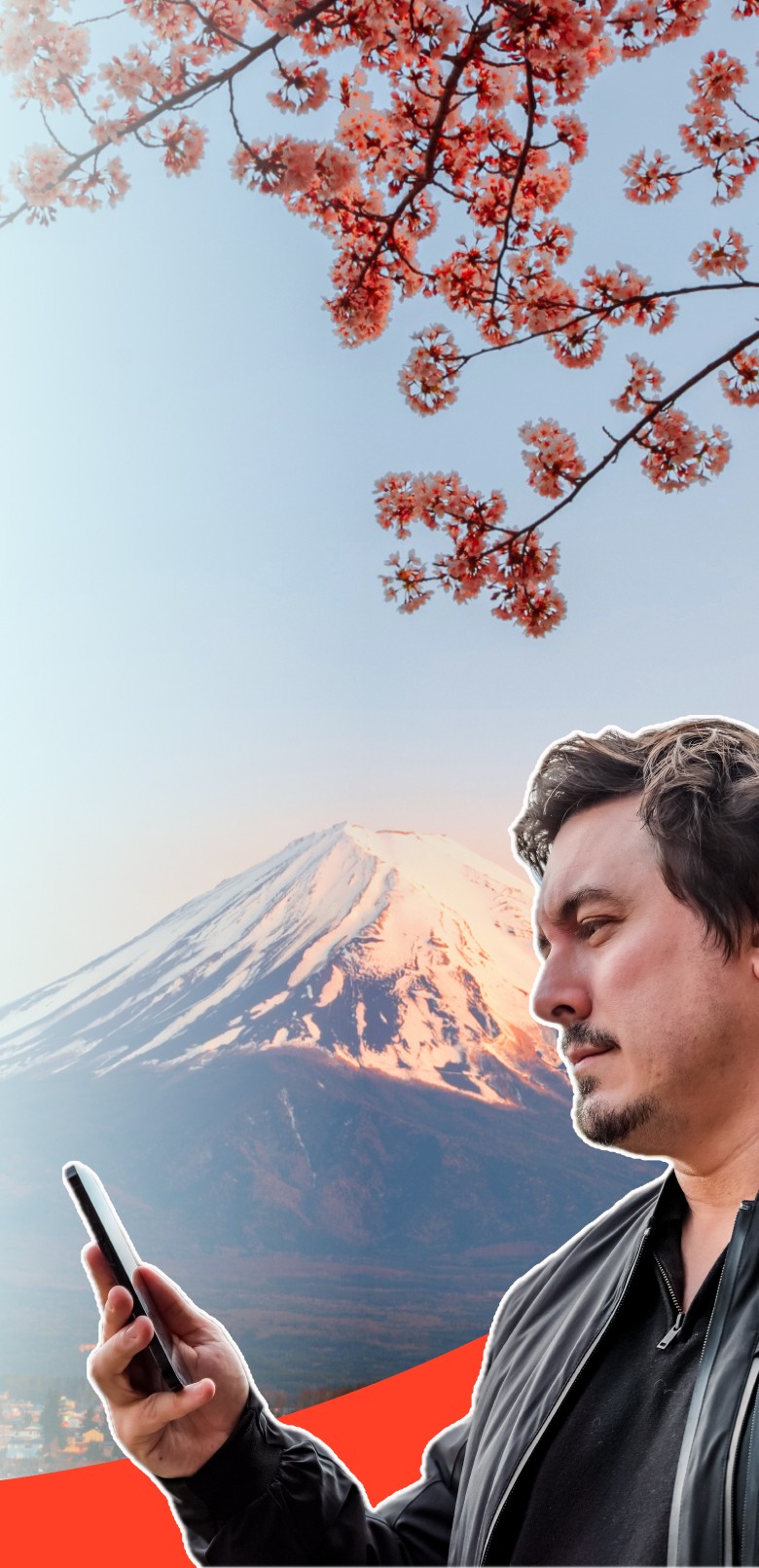 Chris Broad holding a phone with eSIM in front of Mt. Fuji