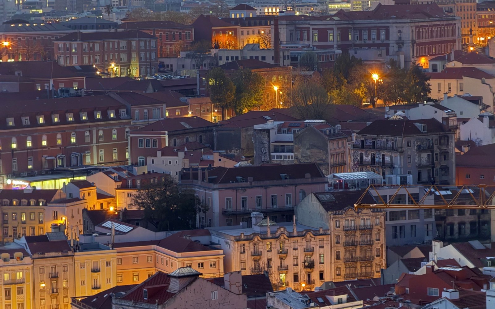 Panoramic evening view over Lisbon rooftops
