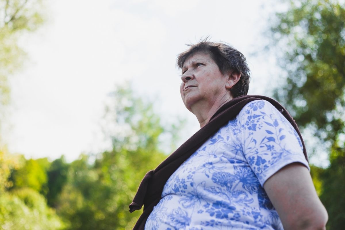 Lost elderly woman wandering outside.