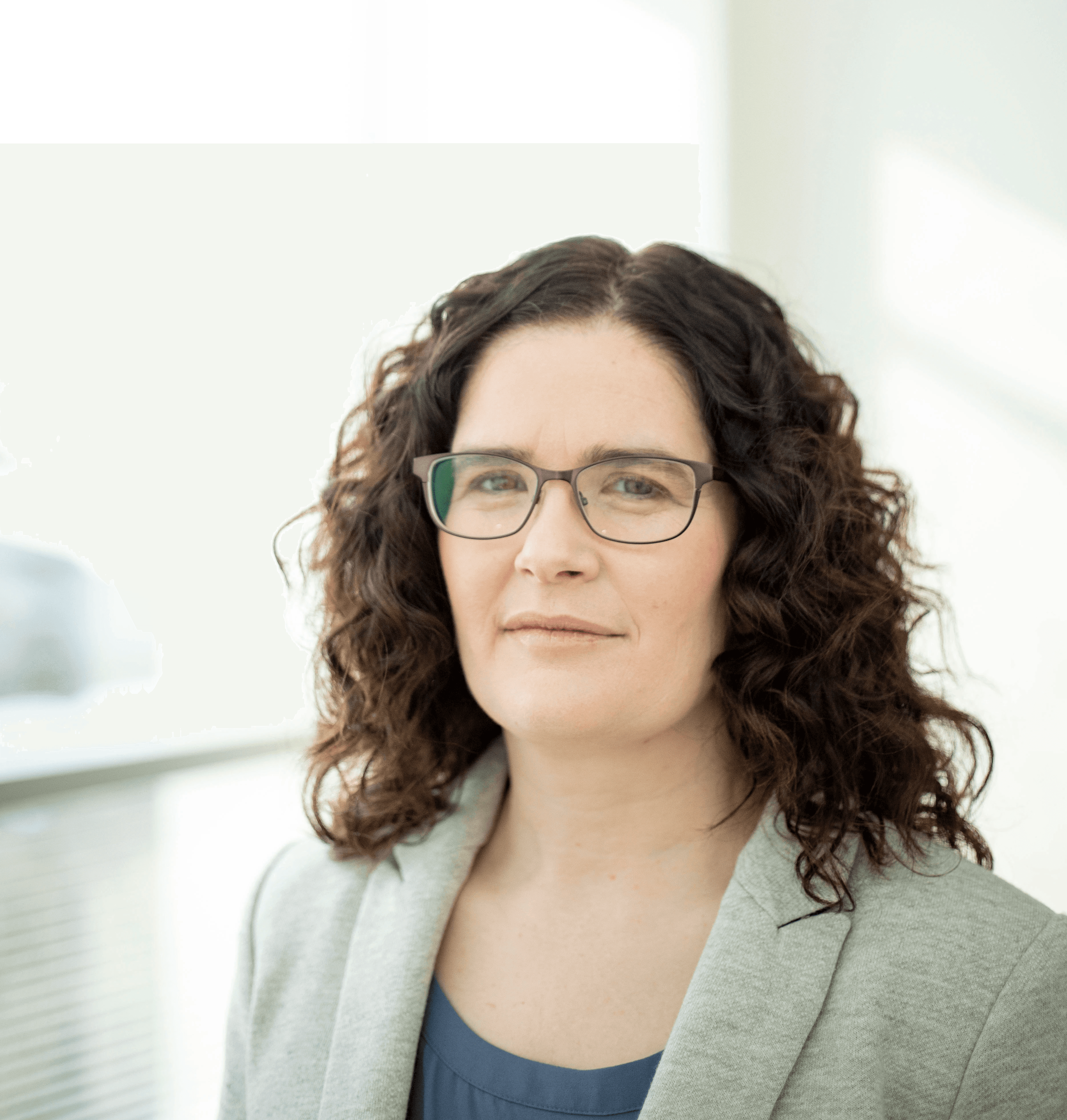 A woman in a grey blazer