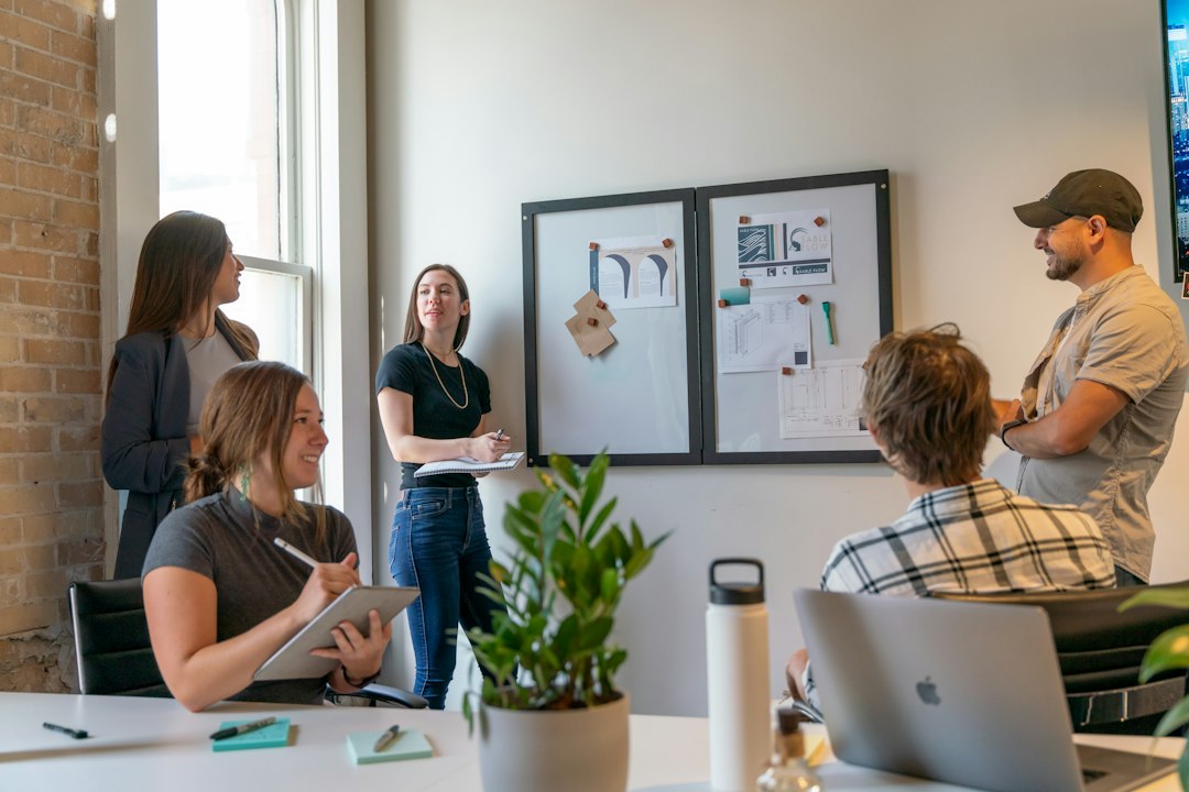 A collaborative meeting between web designers and an NYC business owner