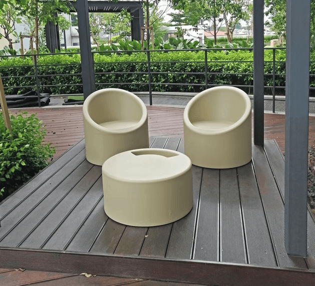 brown wooden chairs and table near glass window