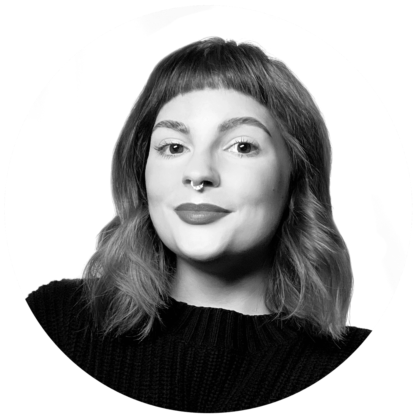 A thoughtful young person with dark hair gazes to the side, captured in soft black and white lighting.