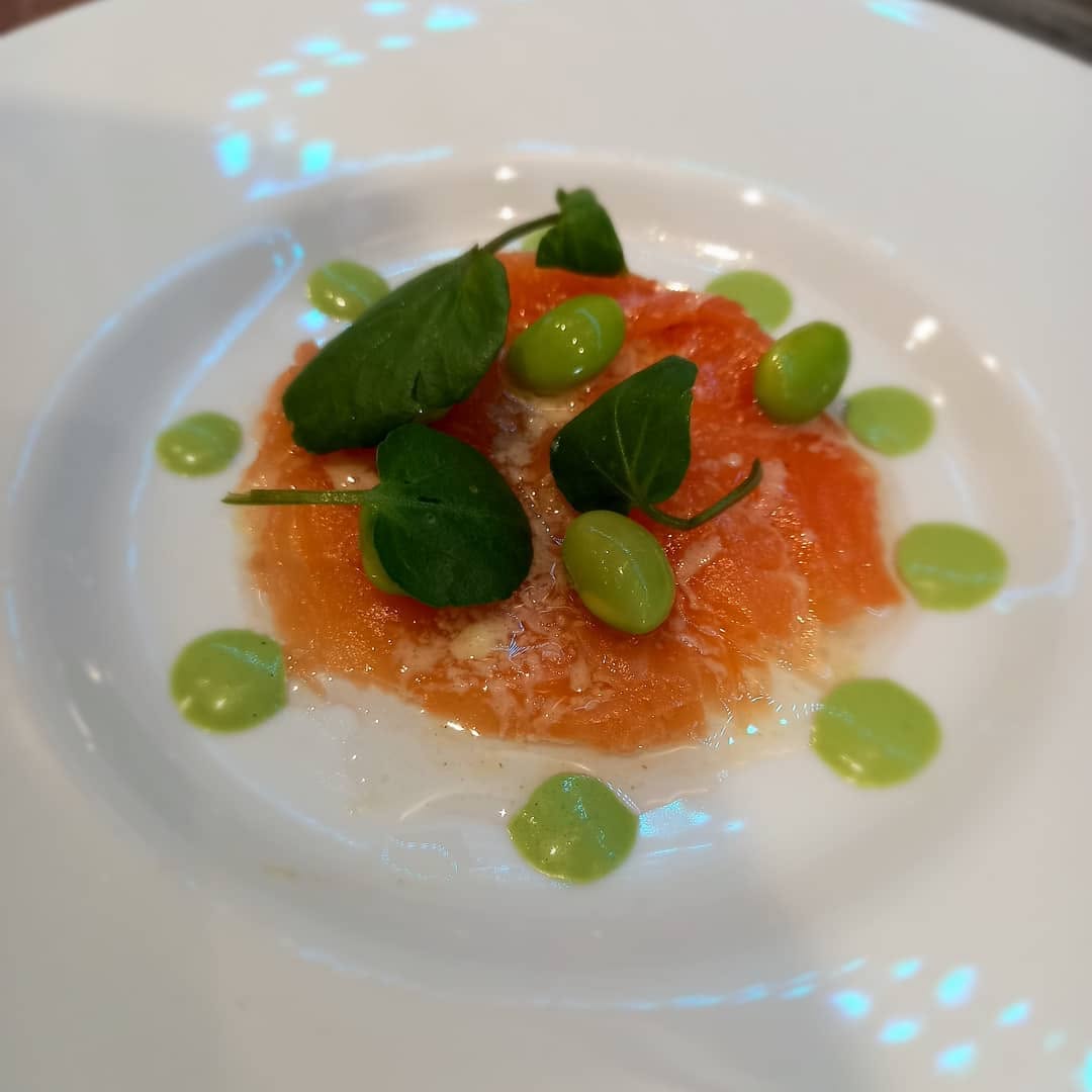 Plated starter with green garnishes