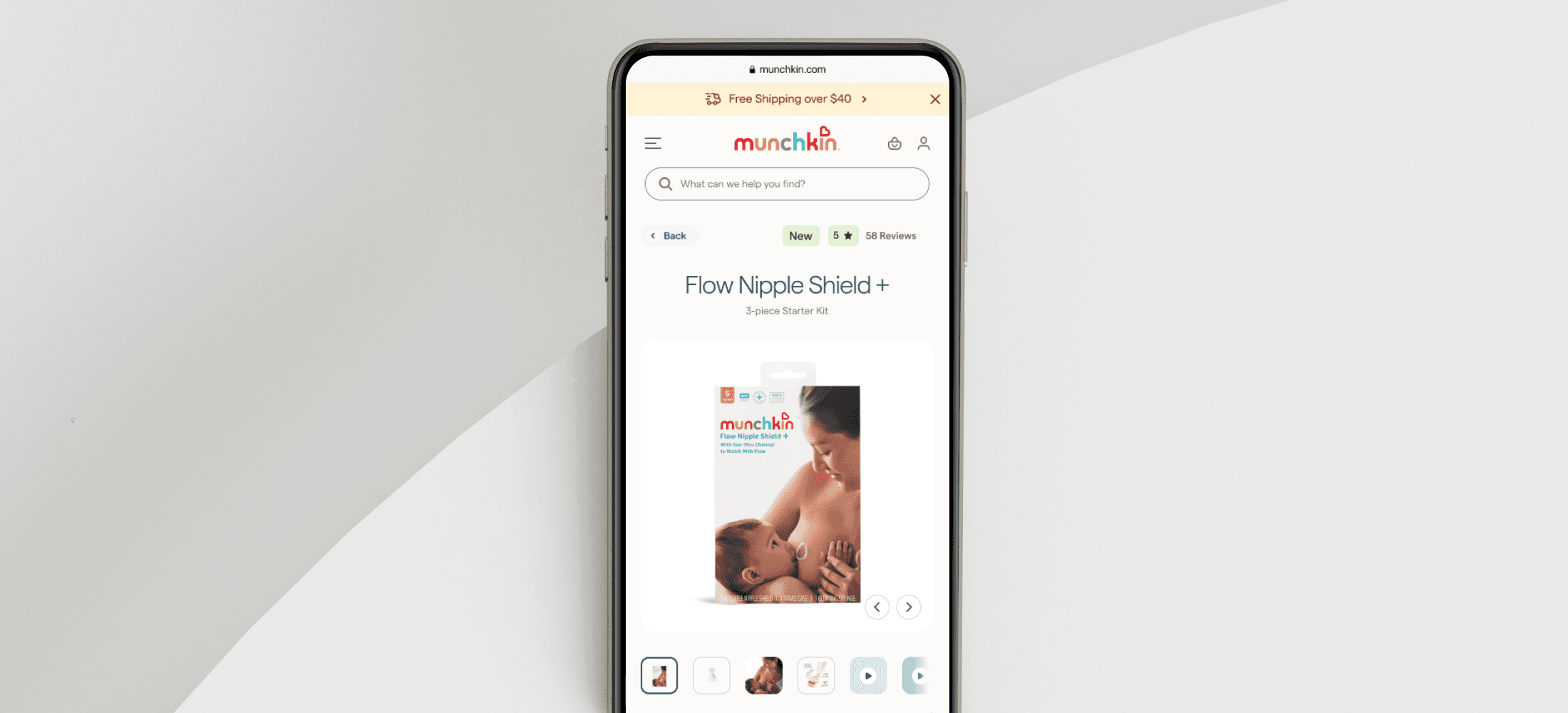 a cellphone leaning against a wall