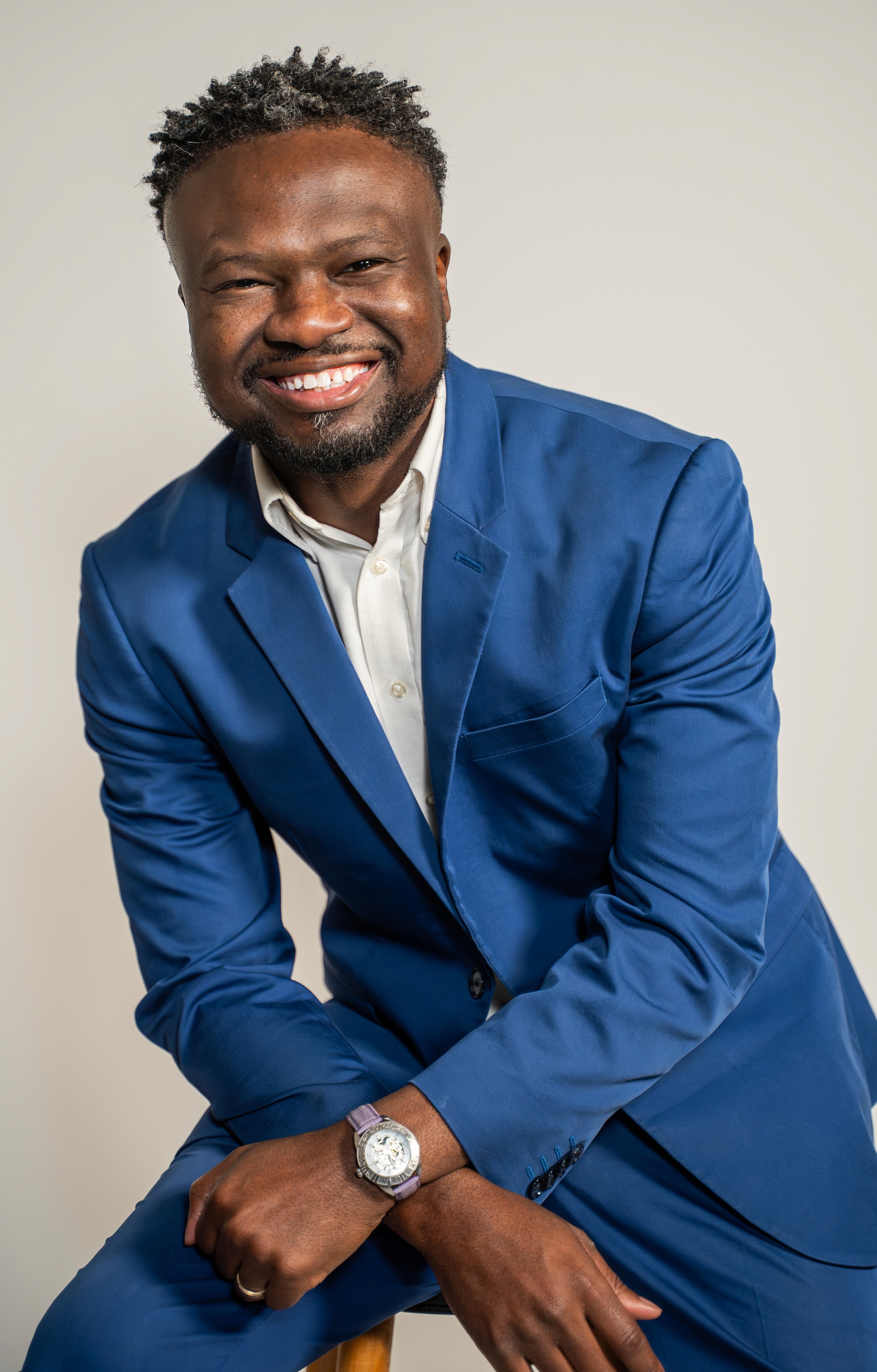 a group of children sitting on steps in front of a building