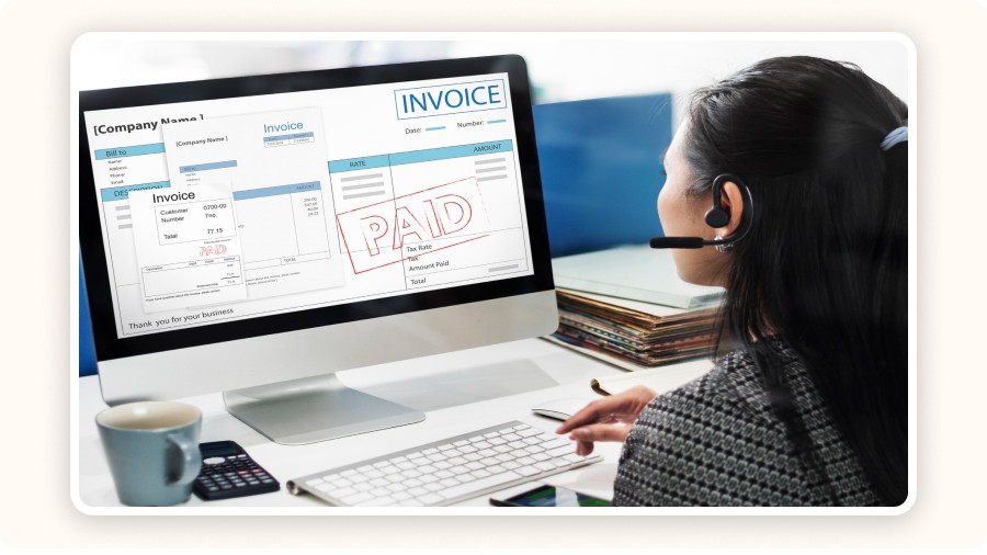 Assistant reviewing a paid electronic invoice