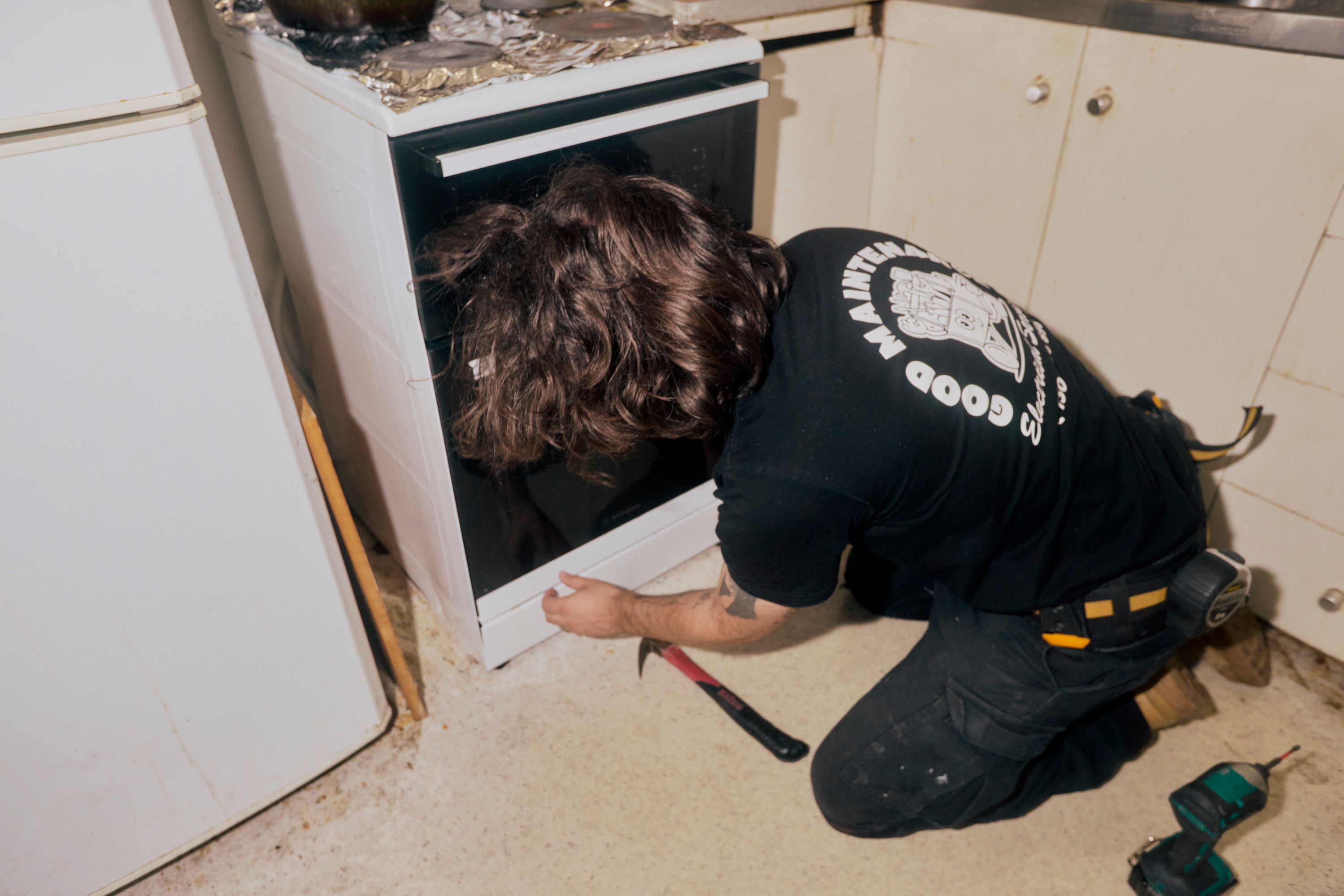 Good Maintenance Technician replacing an oven