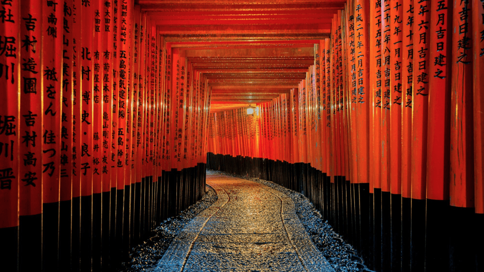 Woman standing in front of a white modern car in a futuristic bulding