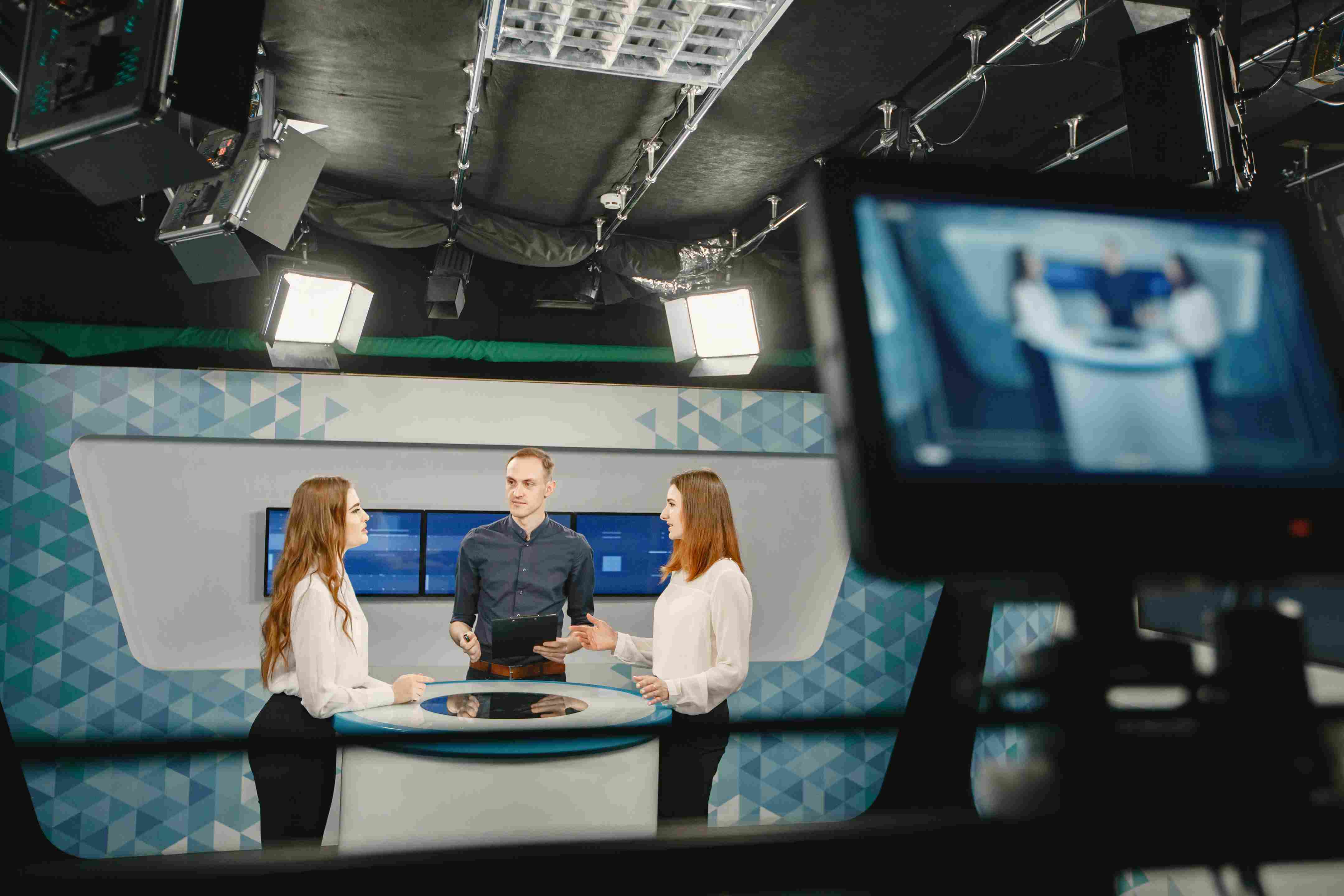 behind the scenes shot of a live panel broadcast