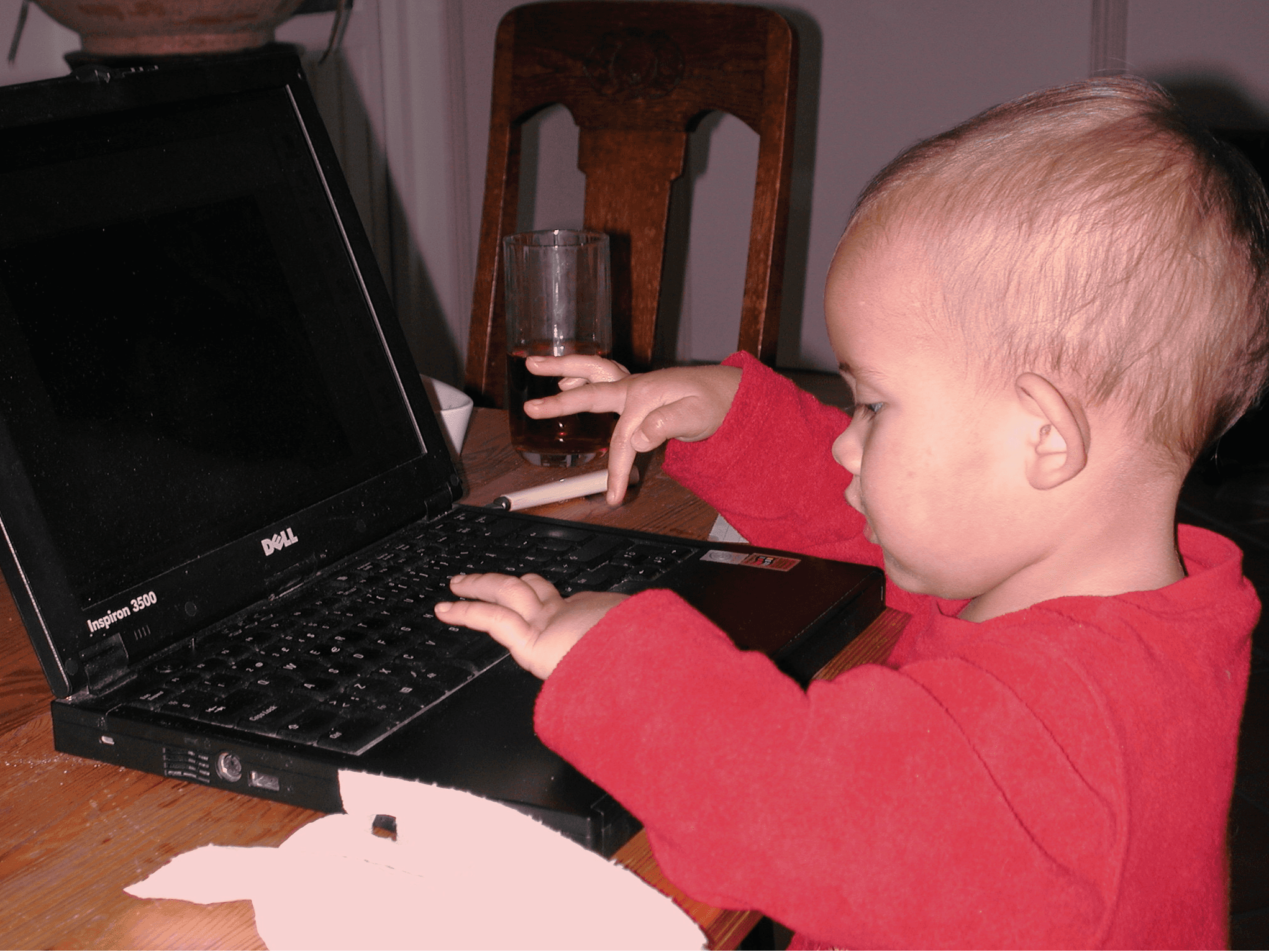a blurry photo of a person standing in front of a wall