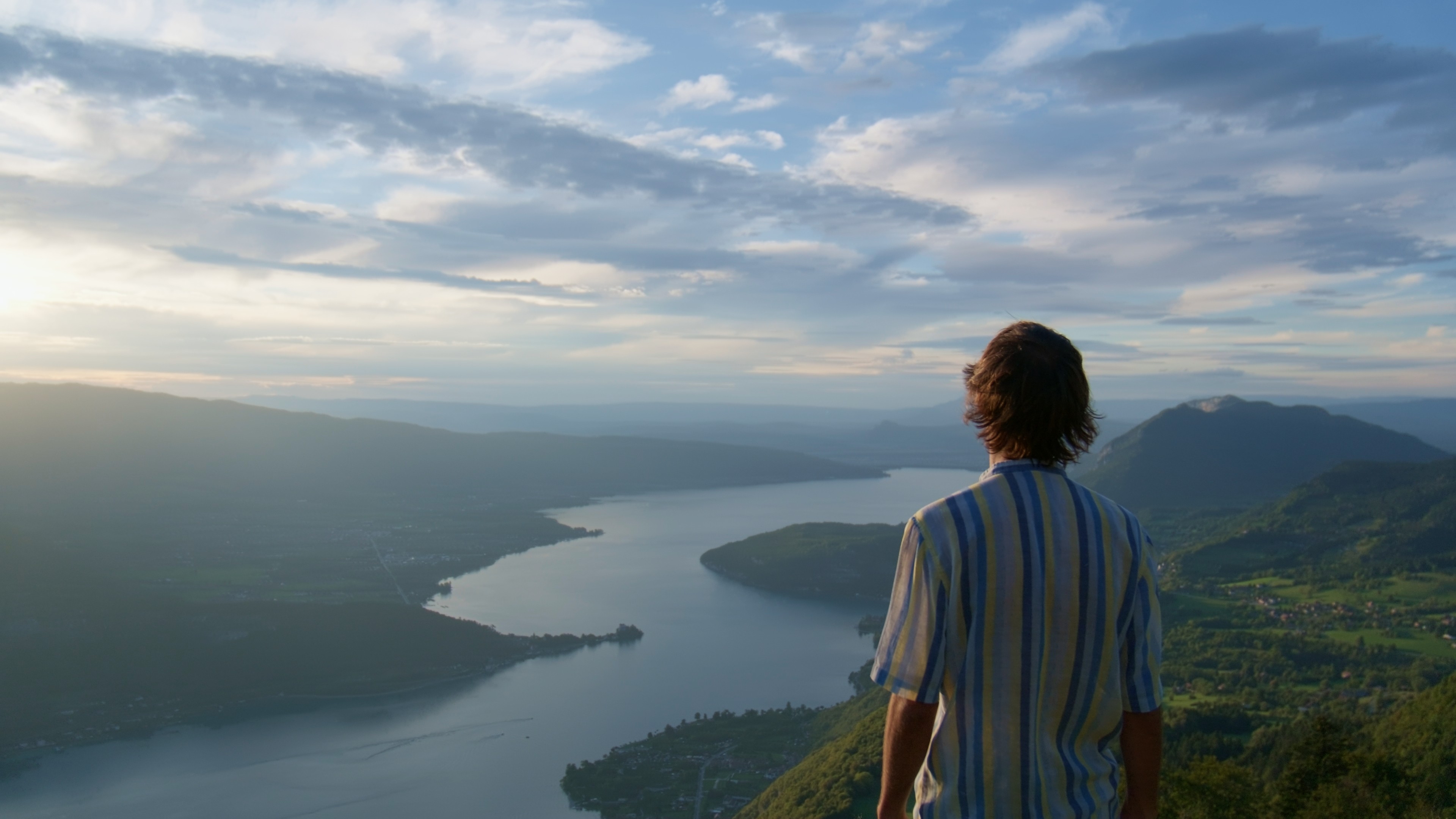 Modern living room with large modular sofa and television.