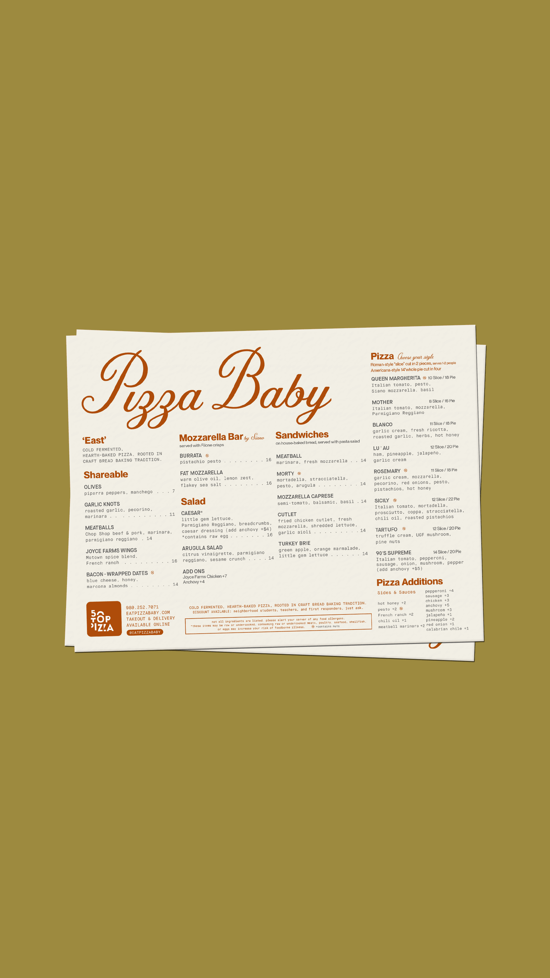 A large group photo of diverse team members gathered in an industrial-style space with arched ceiling.