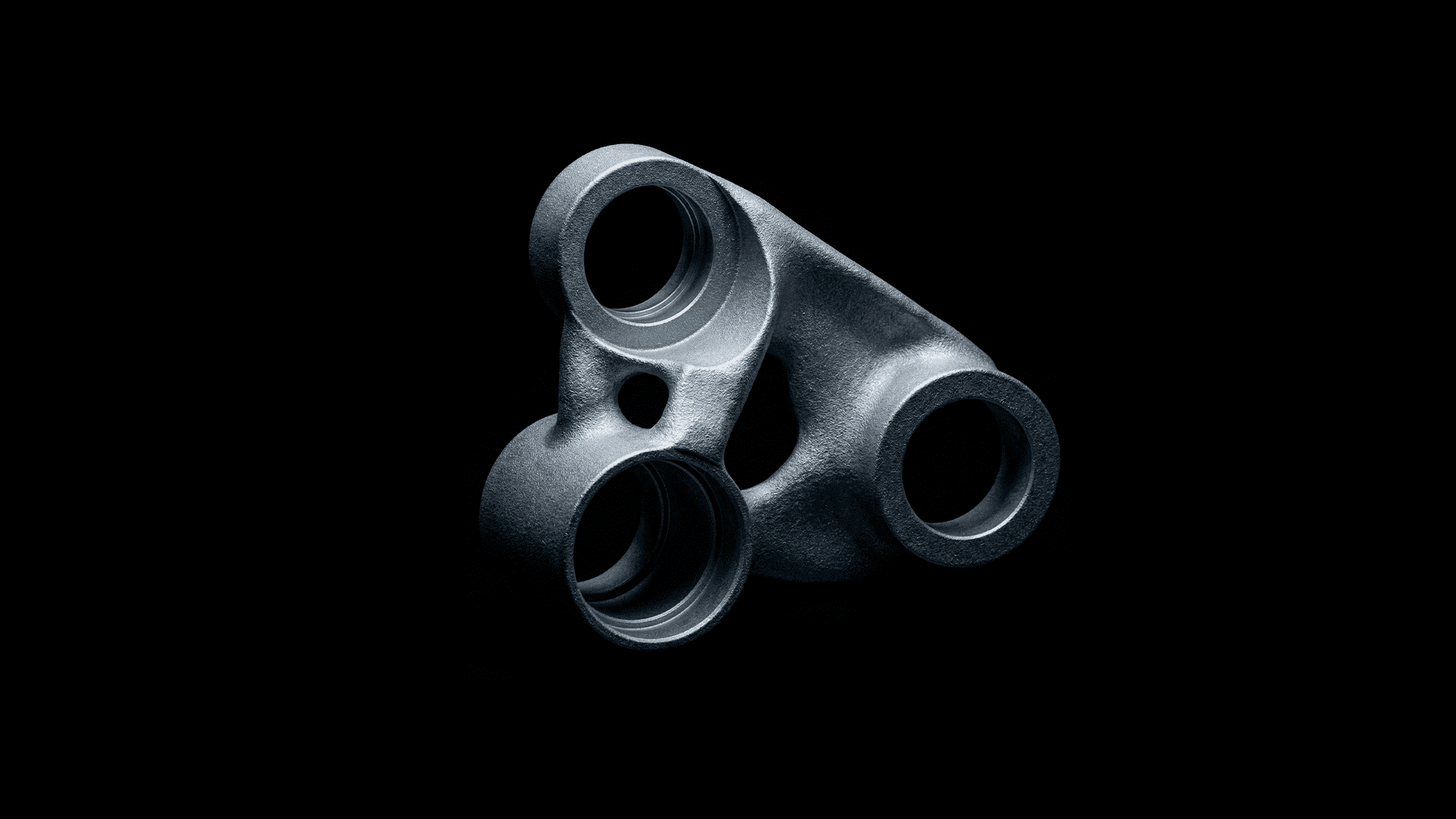 Black and white image of people working at a table with laptops, showing hands gesturing during discussion of digital content displayed on screens, with fabrica® logo in the corner.