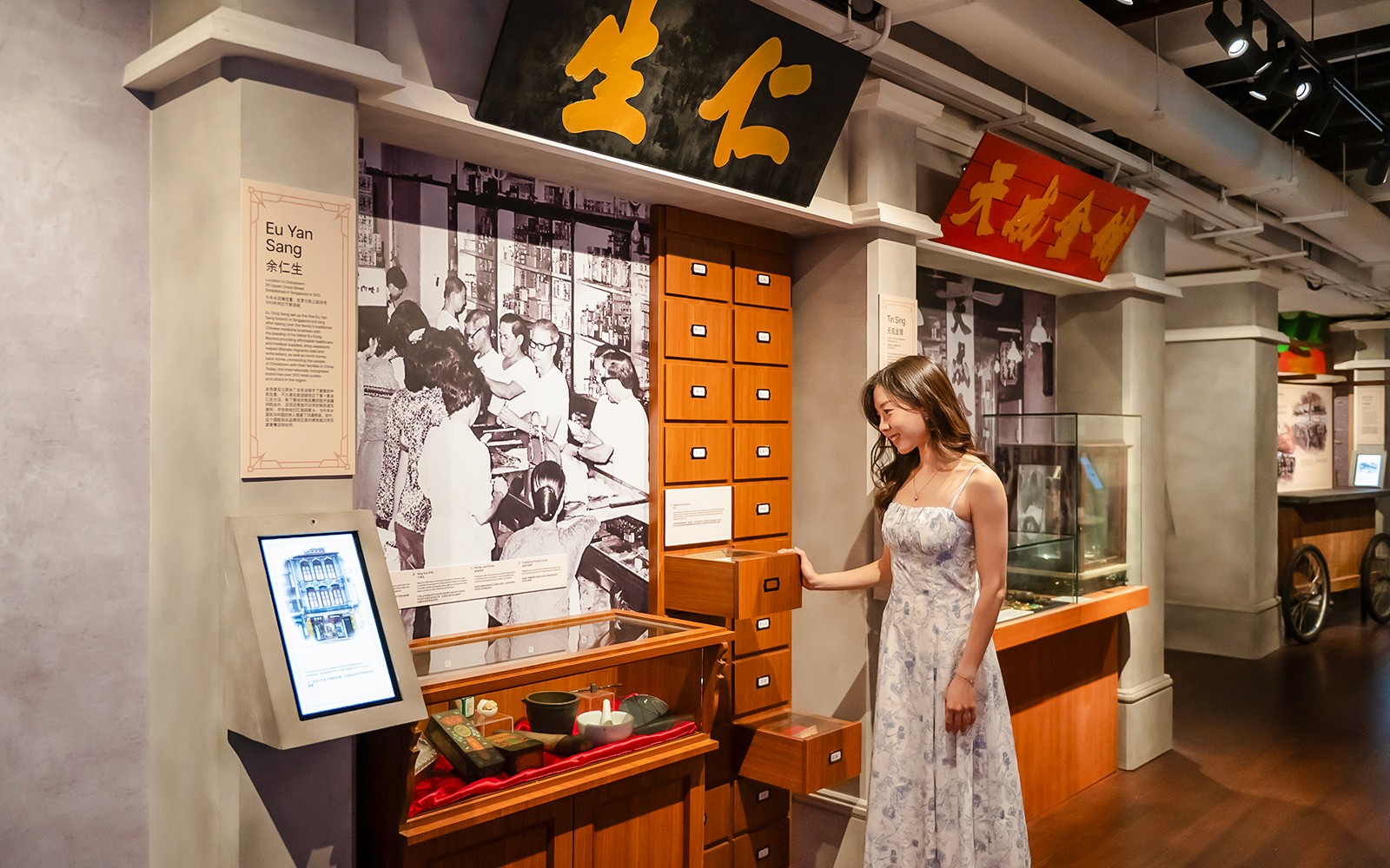 Chinatown Heritage Centre exhibit showcasing Migrants' End and heritage brands in Singapore.