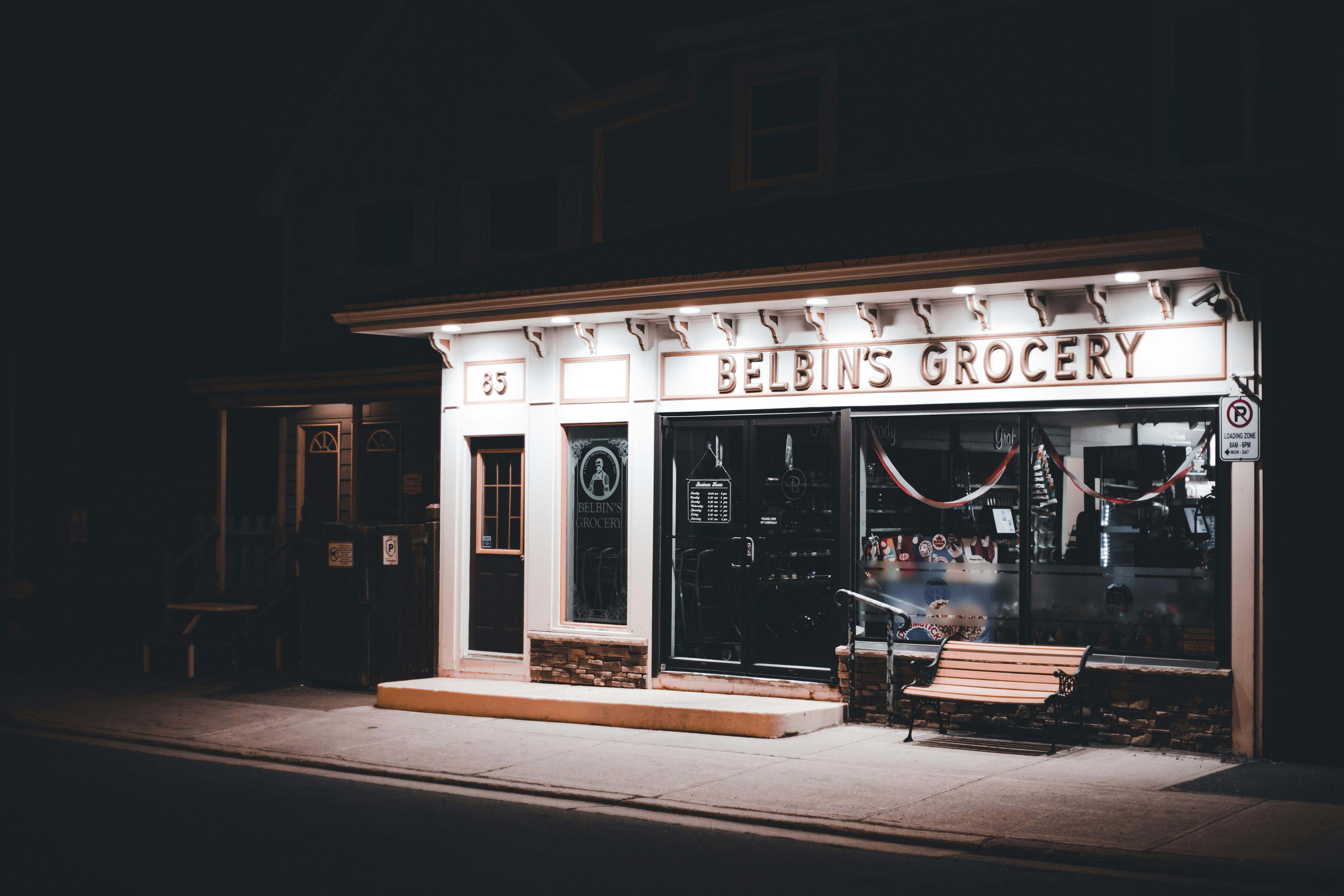 Photo of a small business storefront at night