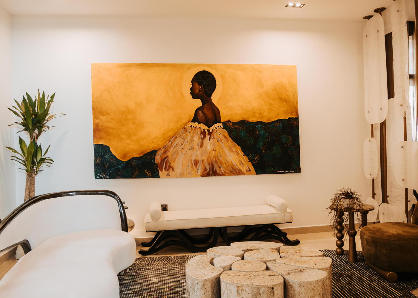 A person stands in a sandstone cave.